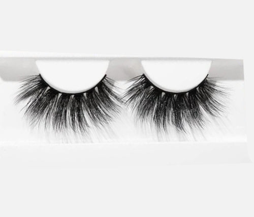 BE BOLD Lashes displayed on a white background, showcasing their luxurious faux mink fibers and dramatic volume.