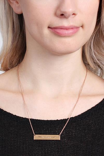 A trendy 'Be Brave' Bar Necklace featuring a rectangular pendant with the phrase 'Be Brave' in gold, rose gold, and silver options.