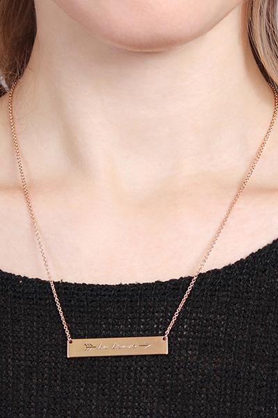 A trendy 'Be Brave' Bar Necklace featuring a rectangular pendant with the phrase 'Be Brave' in gold, rose gold, and silver options.