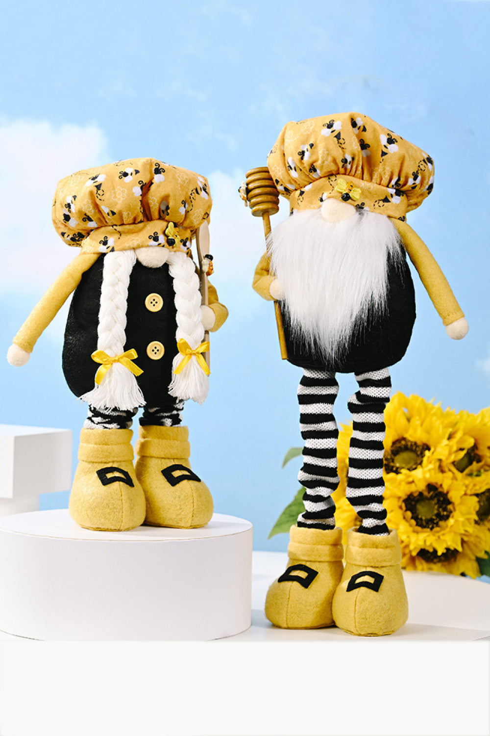 A whimsical Bee Print Telescopic Leg Gnome with adjustable legs, featuring a vibrant bee pattern, perfect for garden or home decor.