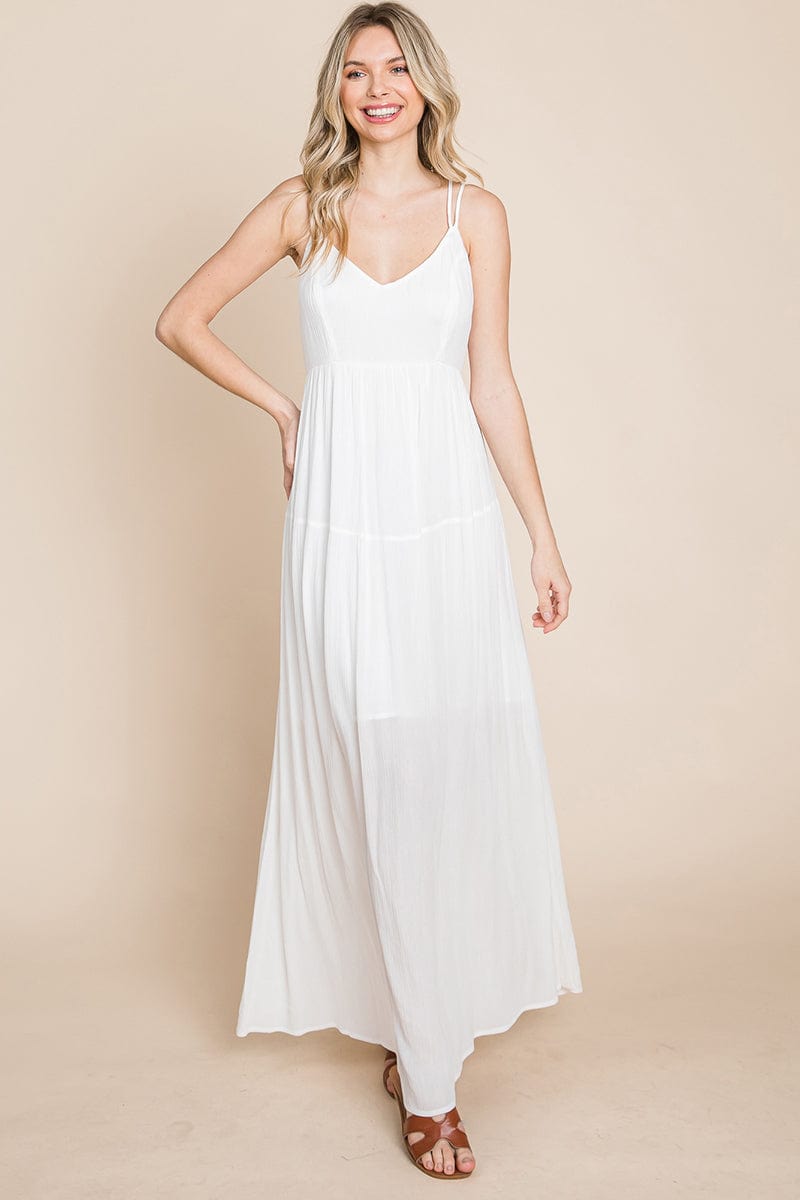 A beautiful Beach Maxi Bridesmaid Dress featuring a criss cross back, high waist, and A-line silhouette, perfect for summer weddings.