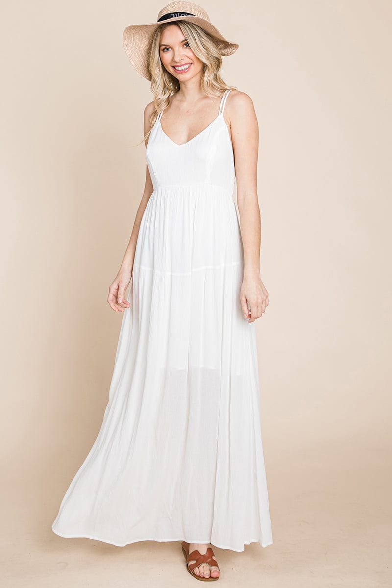 A beautiful Beach Maxi Bridesmaid Dress featuring a criss cross back, high waist, and A-line silhouette, perfect for summer weddings.