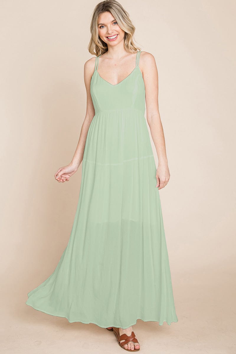 A beautiful Beach Maxi Bridesmaid Dress featuring a criss cross back, high waist, and A-line silhouette, perfect for summer weddings.