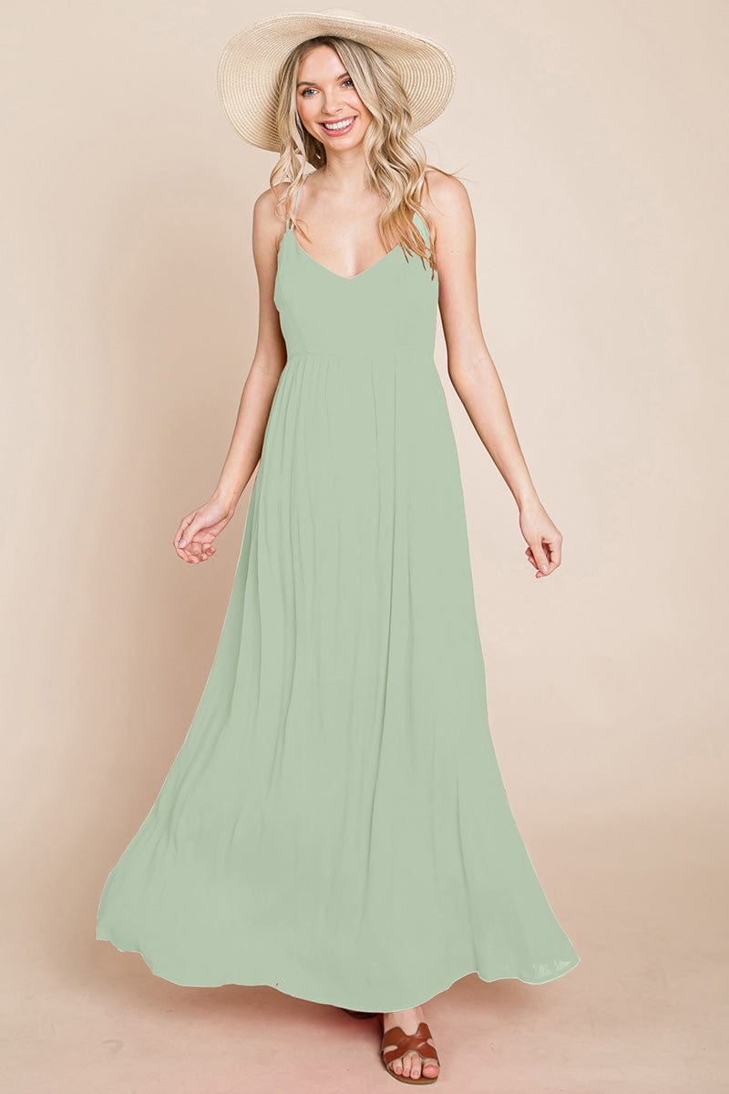 A beautiful Beach Maxi Bridesmaid Dress featuring a criss cross back, high waist, and A-line silhouette, perfect for summer weddings.