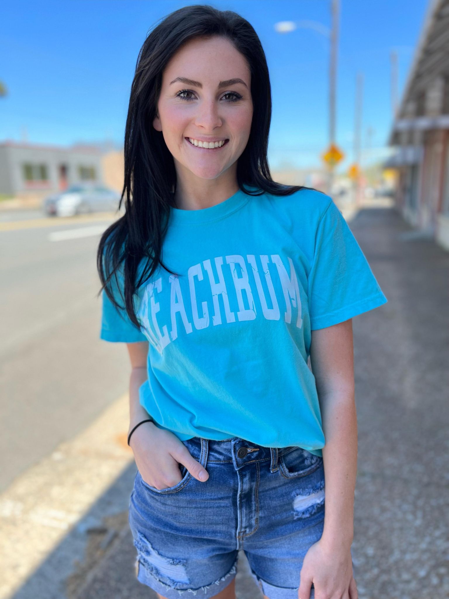 Bright blue BeachBum tee shirt made of 100% cotton, perfect for summer wear.