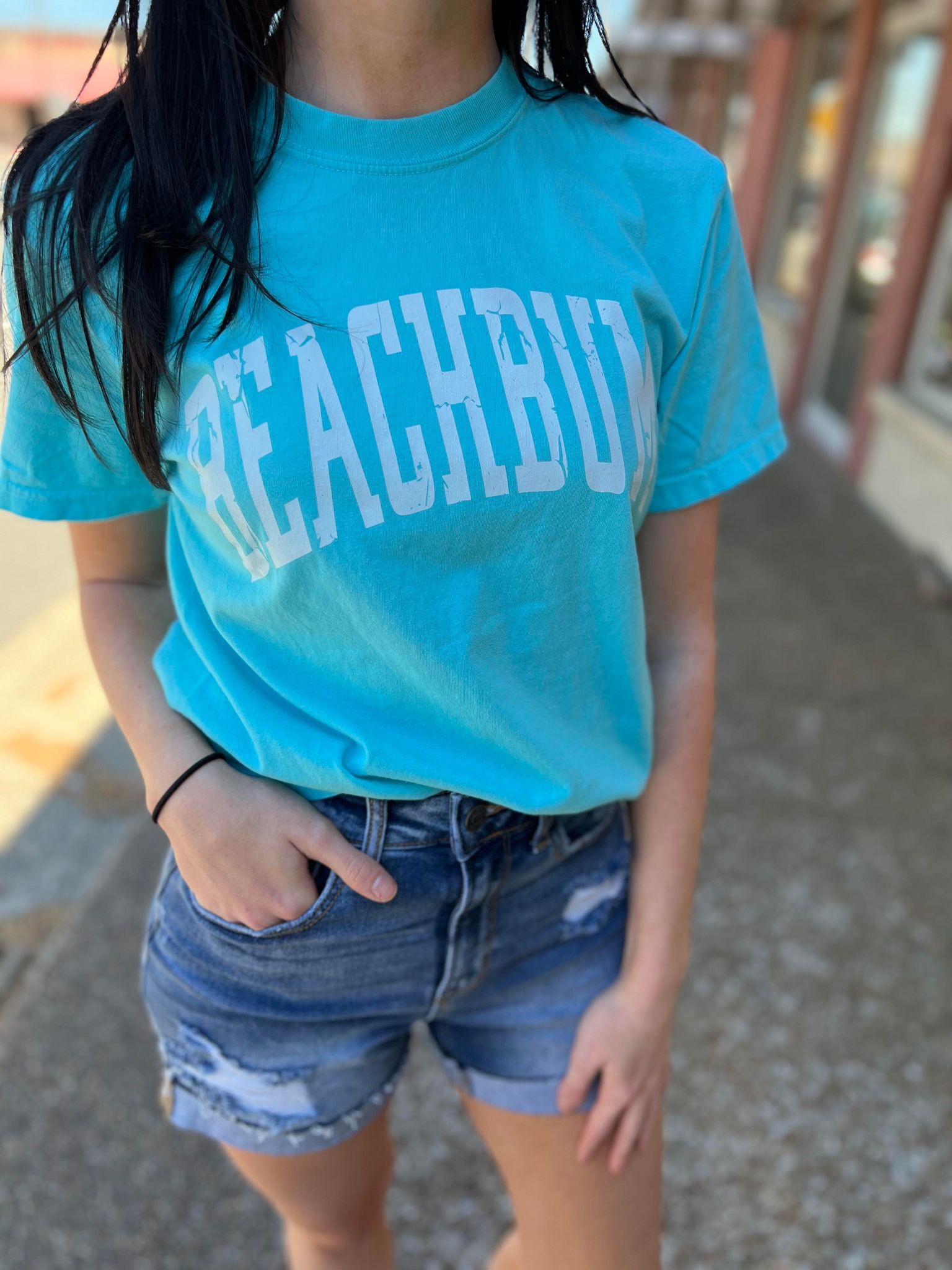 Bright blue BeachBum tee shirt made of 100% cotton, perfect for summer wear.