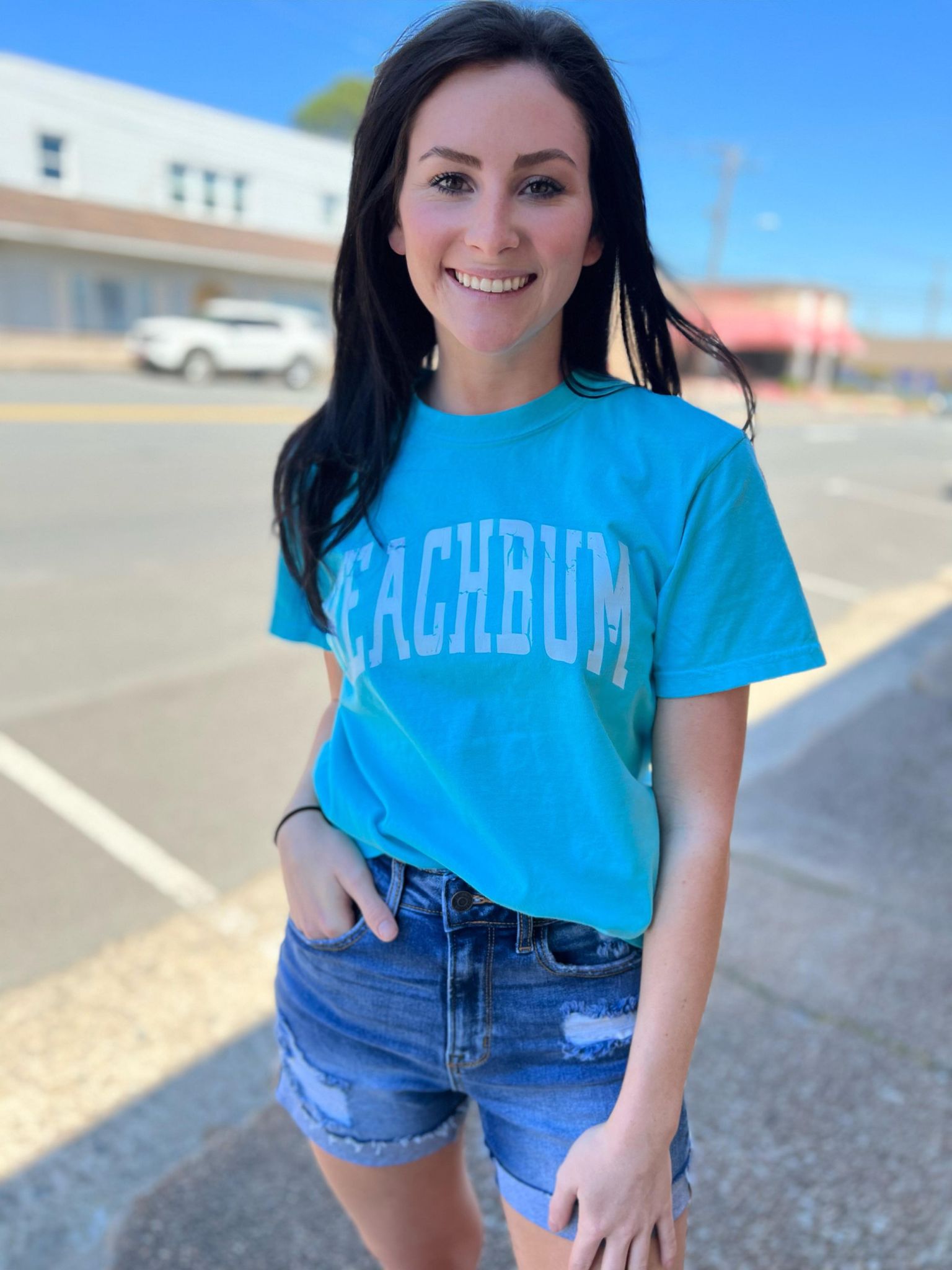 Bright blue BeachBum tee shirt made of 100% cotton, perfect for summer wear.