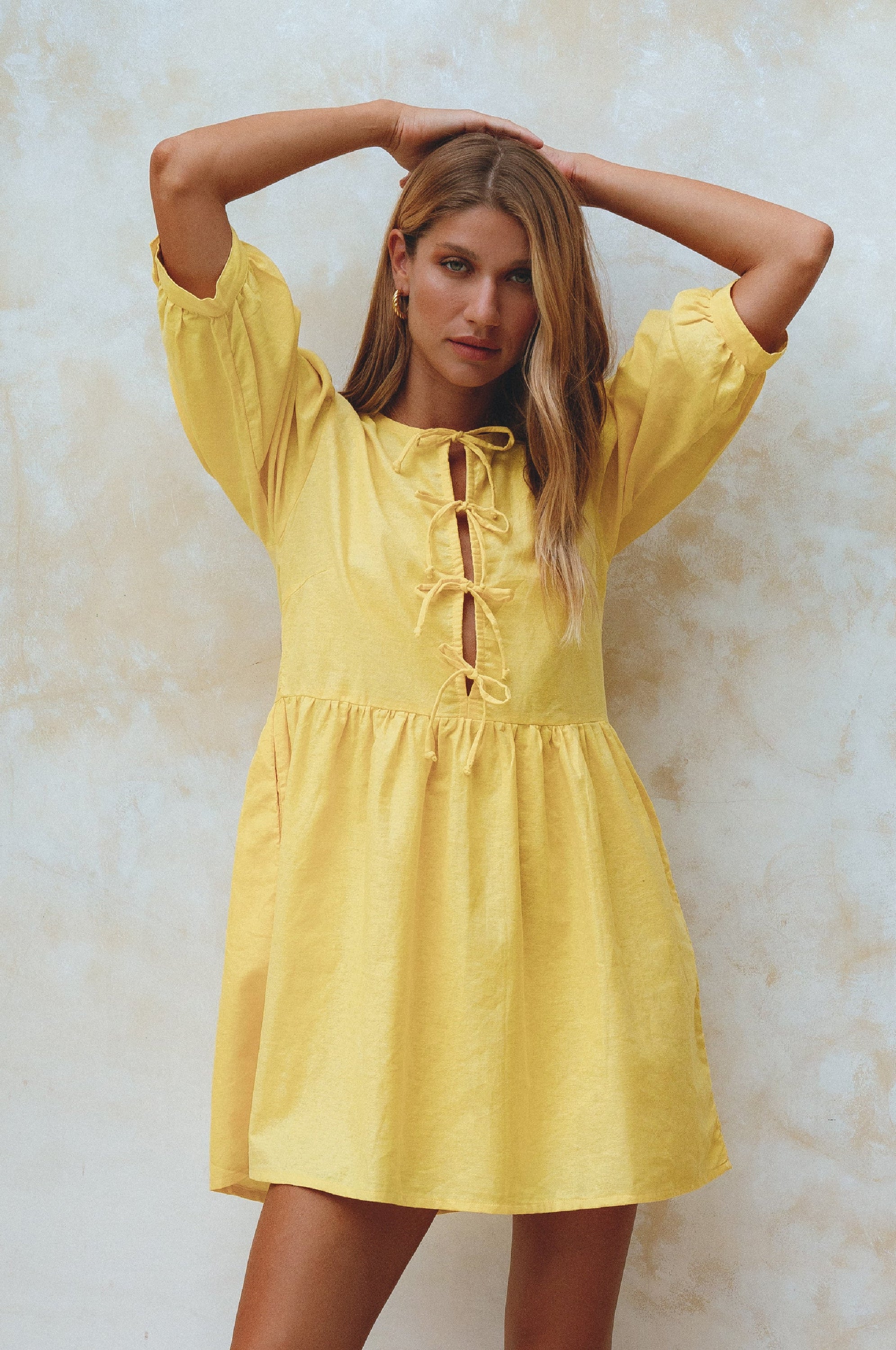 Beatrice Puff Sleeve Linen Mini Dress in vibrant summer colors, featuring adjustable ties and a babydoll silhouette.