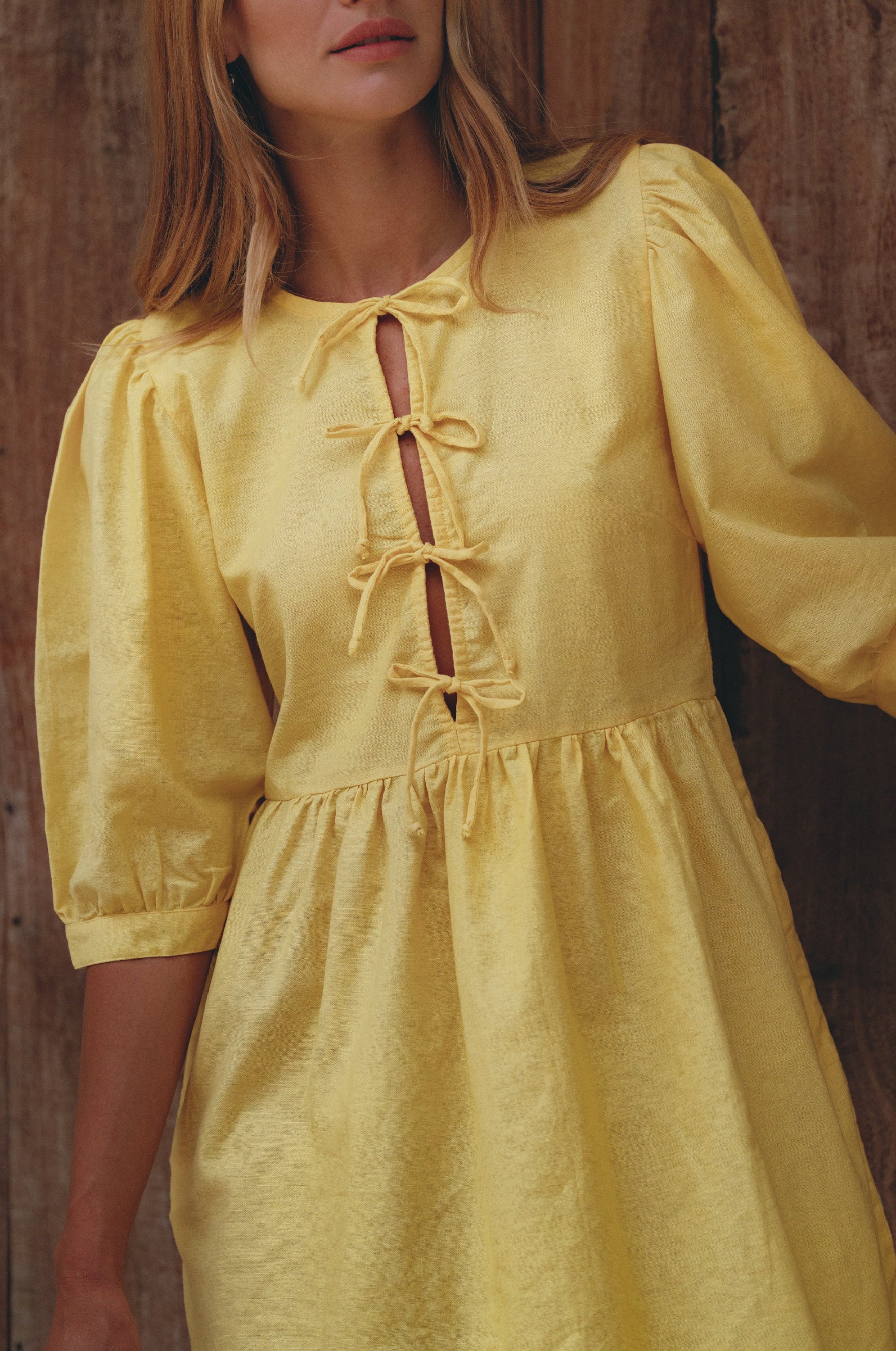 Beatrice Puff Sleeve Linen Mini Dress in vibrant summer colors, featuring adjustable ties and a babydoll silhouette.