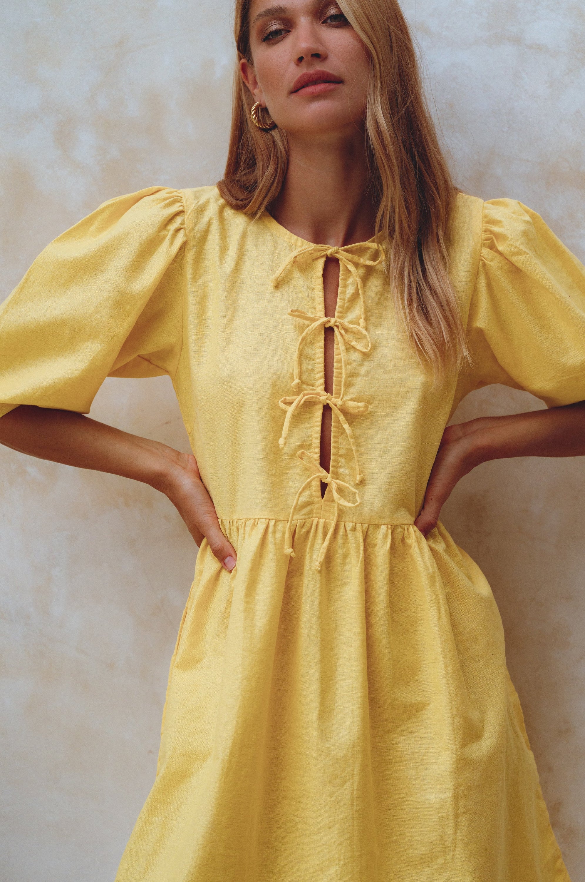 Beatrice Puff Sleeve Linen Mini Dress in vibrant summer colors, featuring adjustable ties and a babydoll silhouette.