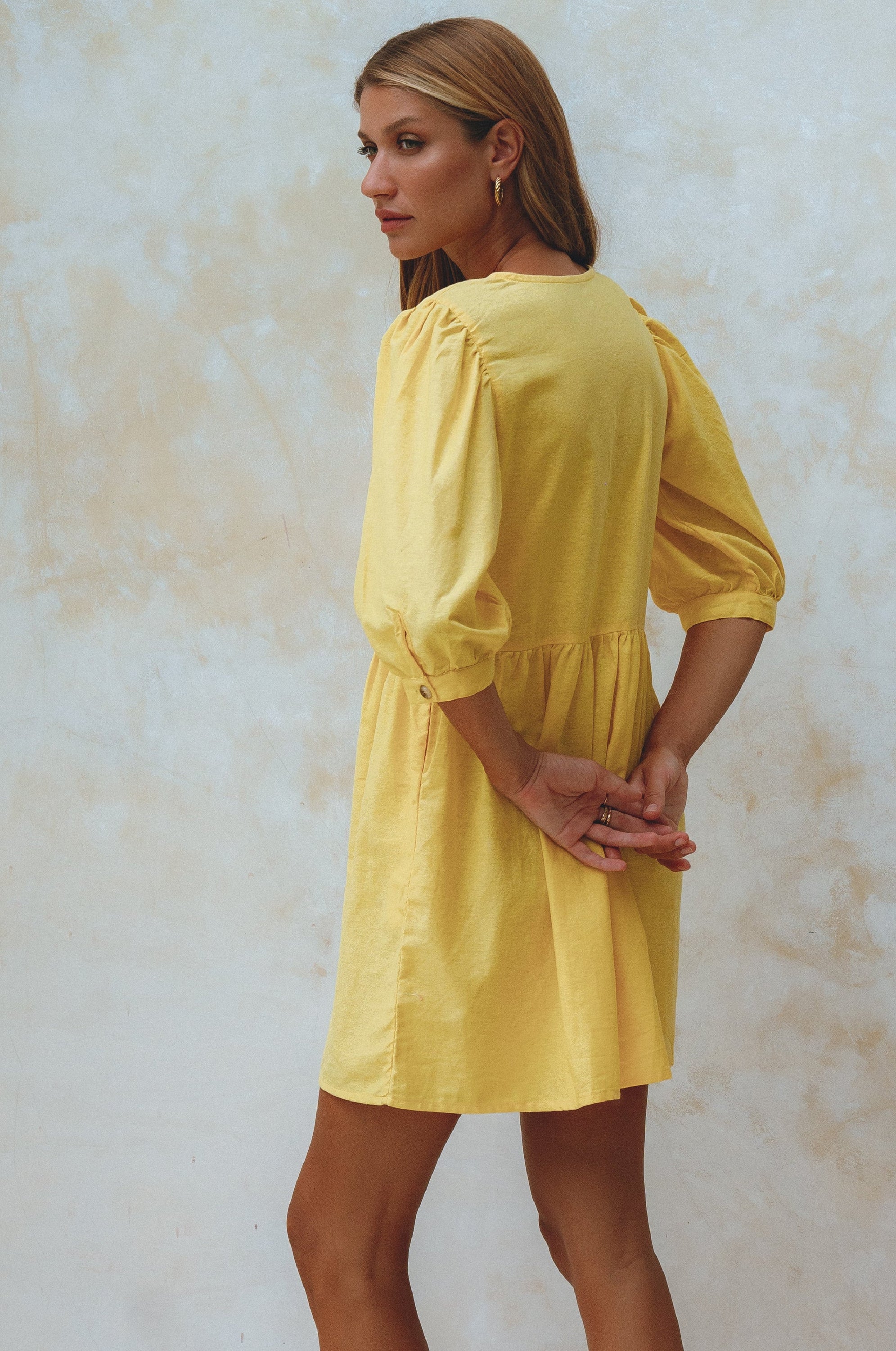 Beatrice Puff Sleeve Linen Mini Dress in vibrant summer colors, featuring adjustable ties and a babydoll silhouette.