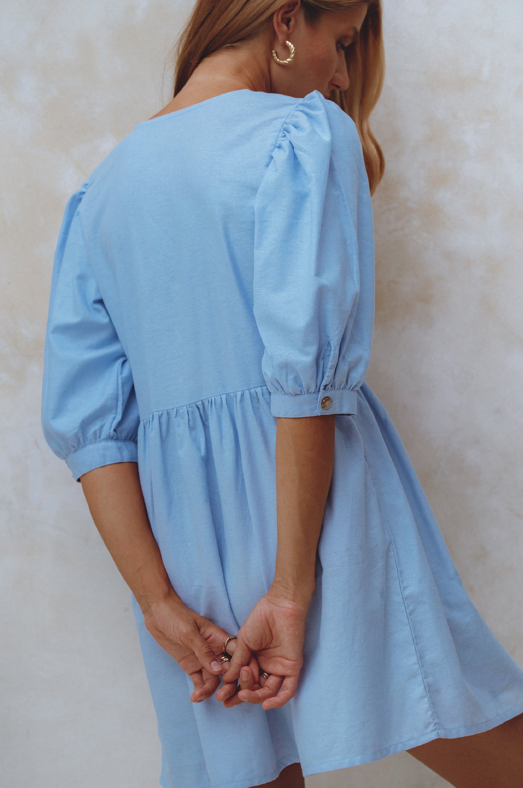 Beatrice Puff Sleeve Linen Mini Dress in vibrant summer colors, featuring adjustable ties and a babydoll silhouette.