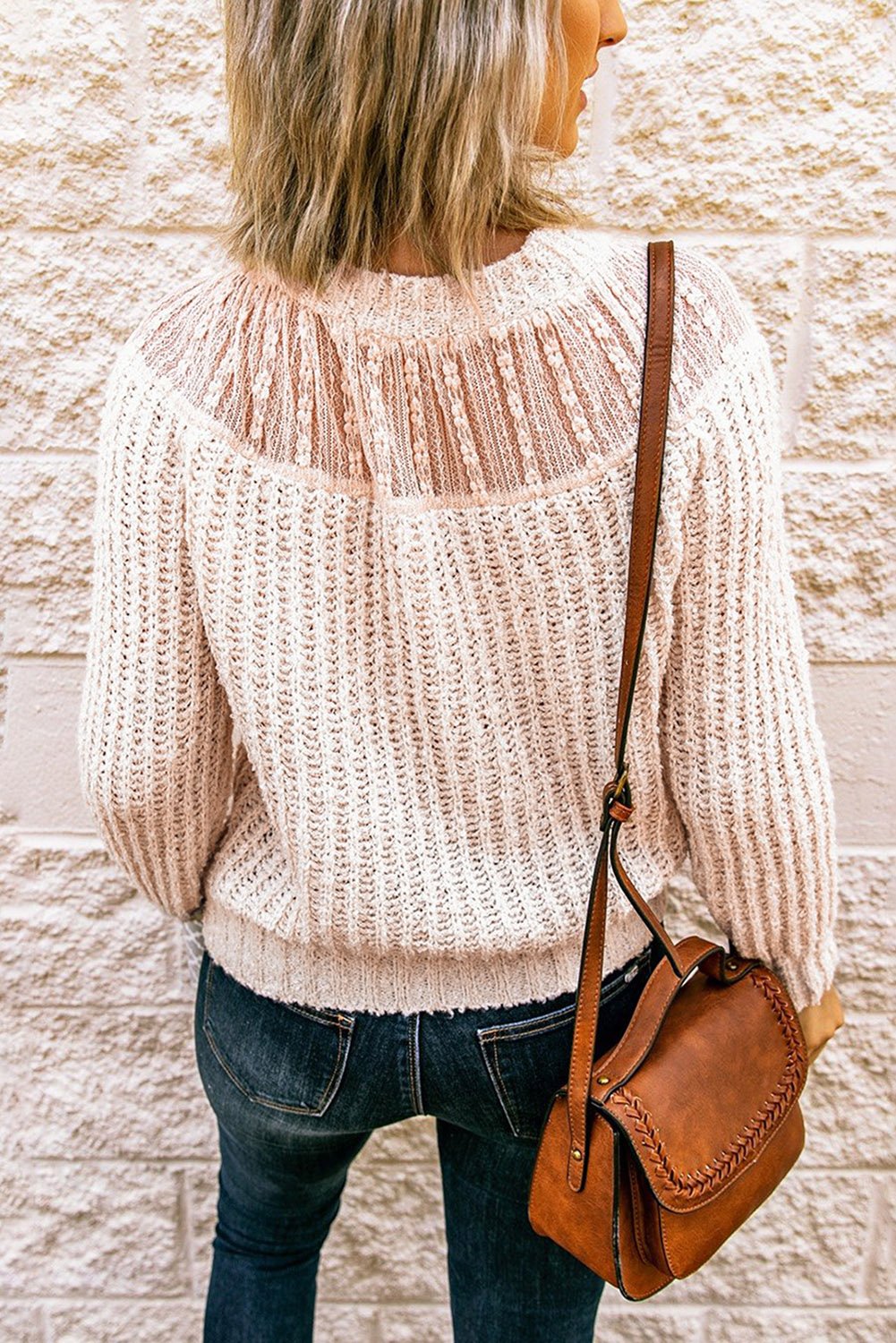 Beige round neck knitted sweater with lace splicing, showcasing a stylish design perfect for chilly seasons.