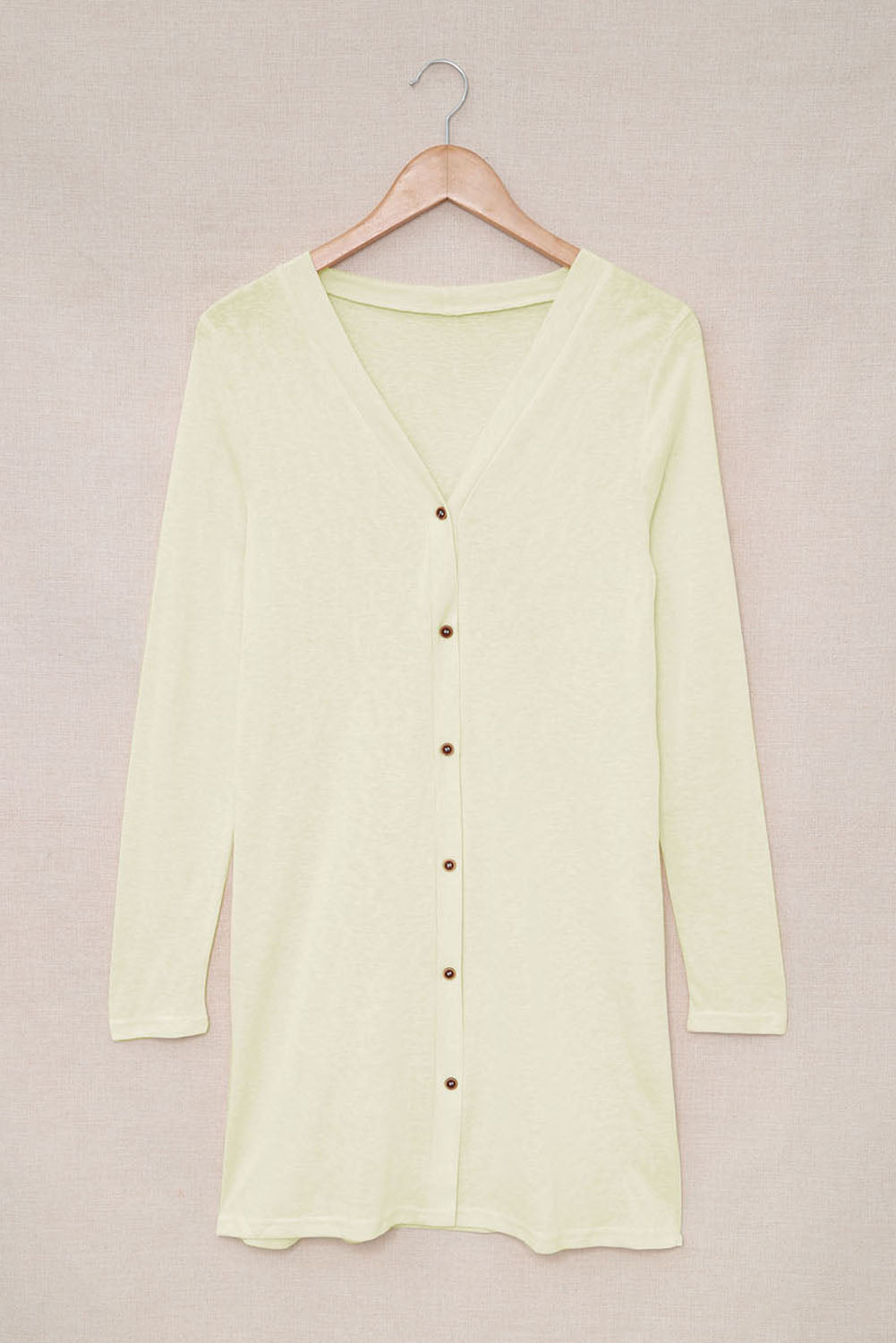 Beige solid color open-front cardigan with buttons, showcasing a loose fit and longline style, perfect for layering in autumn and spring.