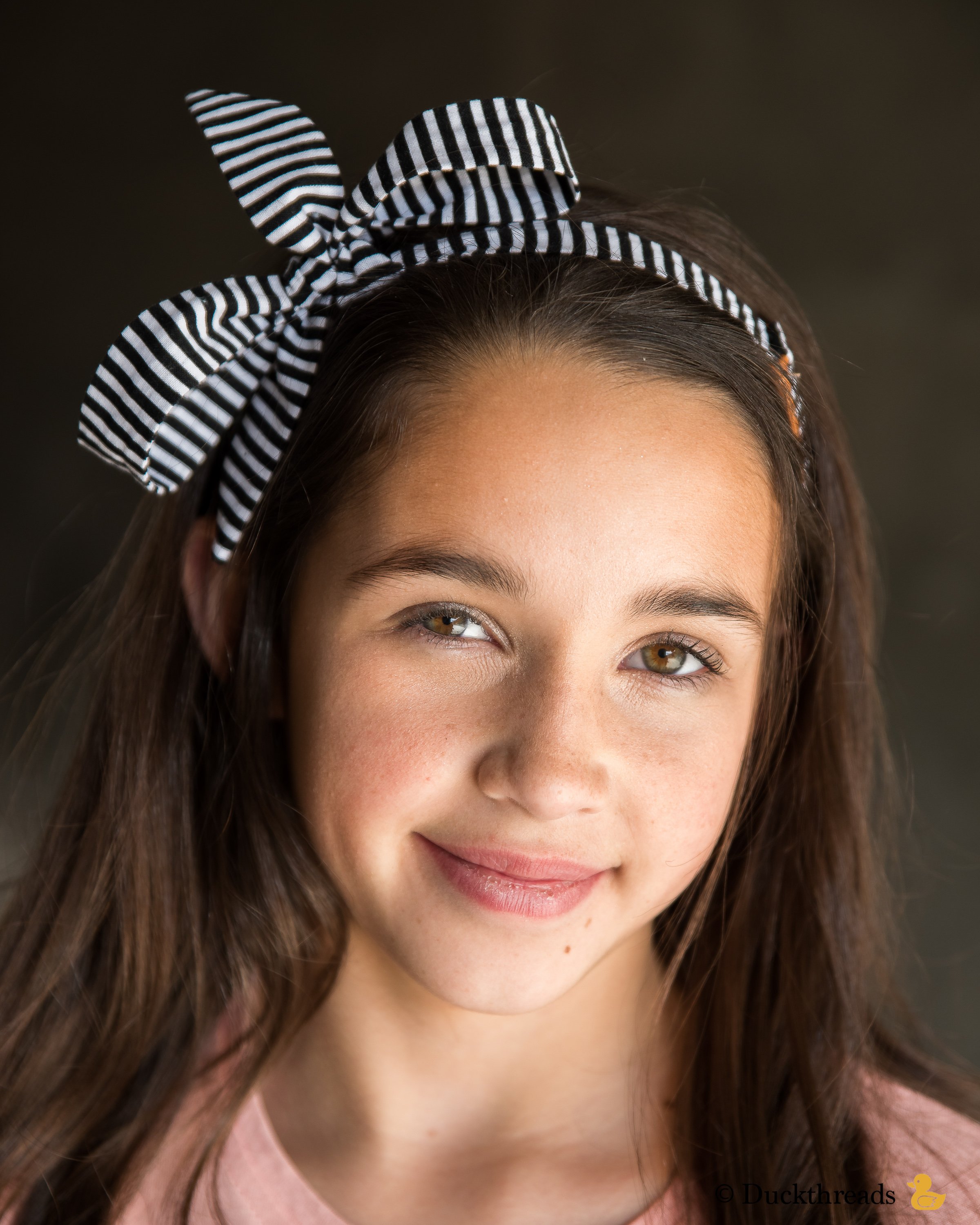 BeltBand reversible belt and headband made from leather and cotton fabric, showcasing black and white stripes.