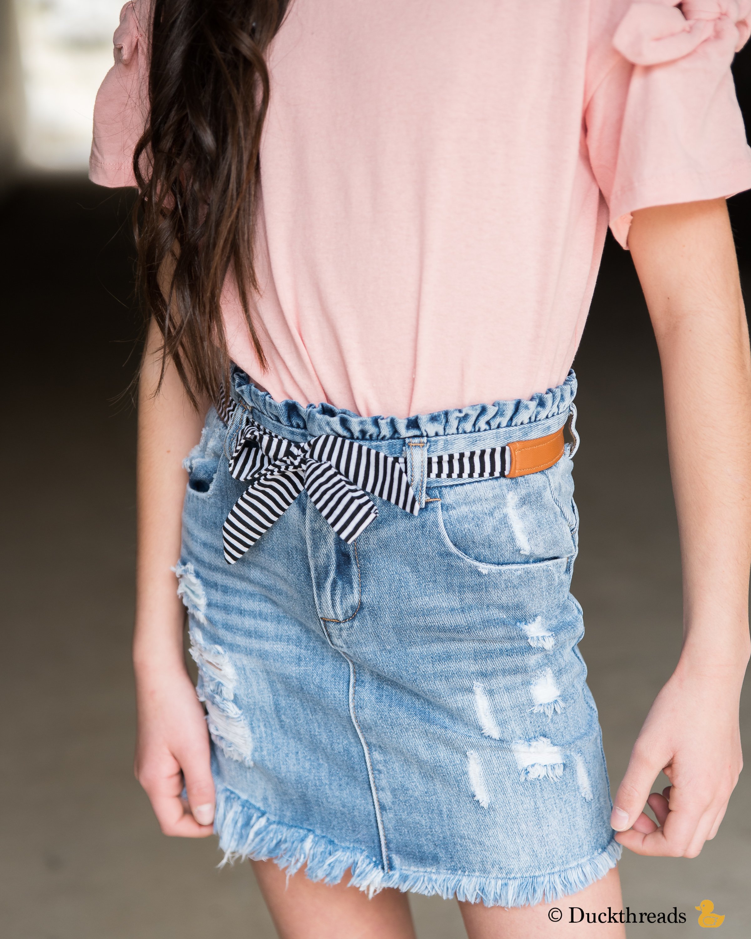 BeltBand reversible belt and headband made from leather and cotton fabric, showcasing black and white stripes.