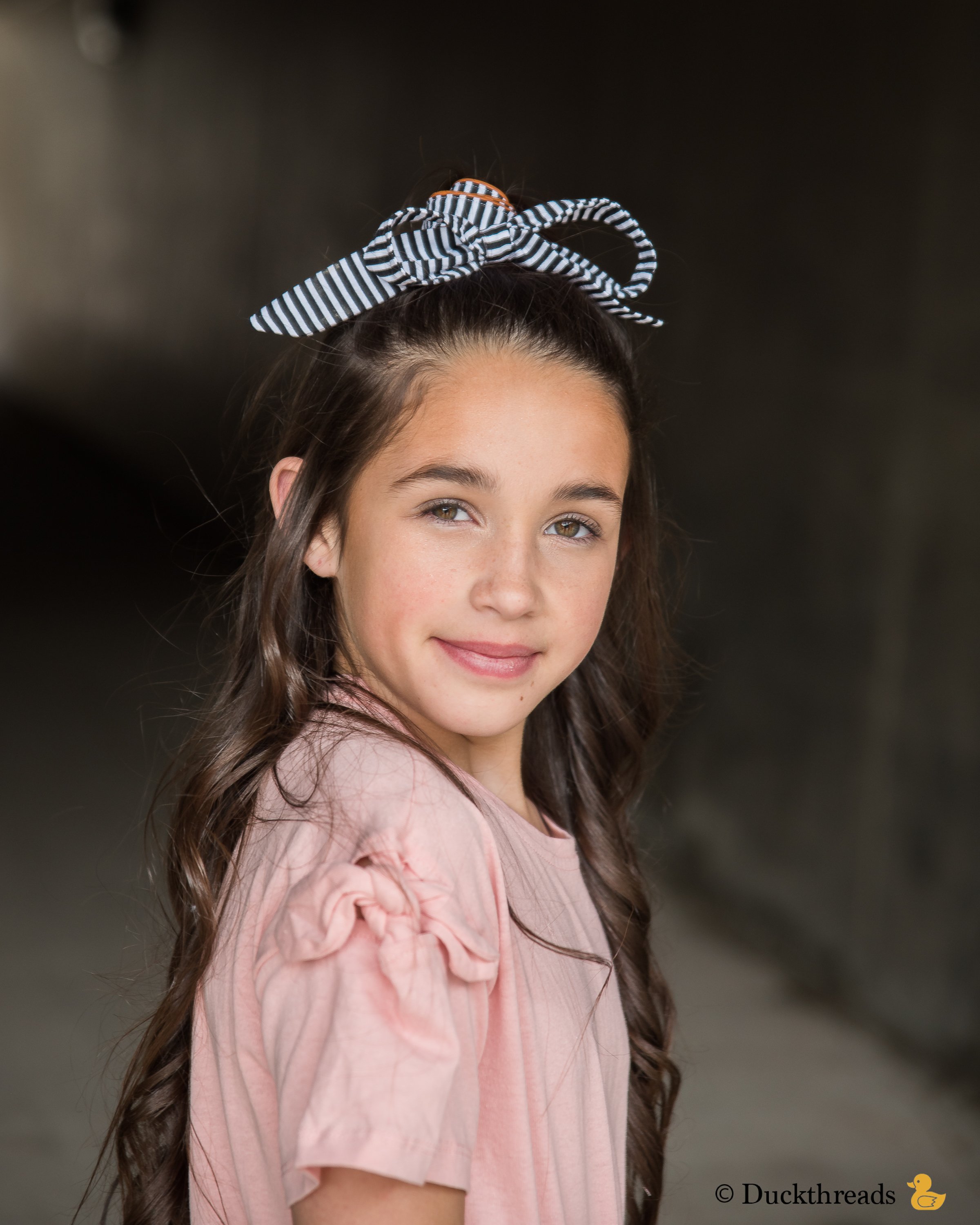 BeltBand reversible belt and headband made from leather and cotton fabric, showcasing black and white stripes.