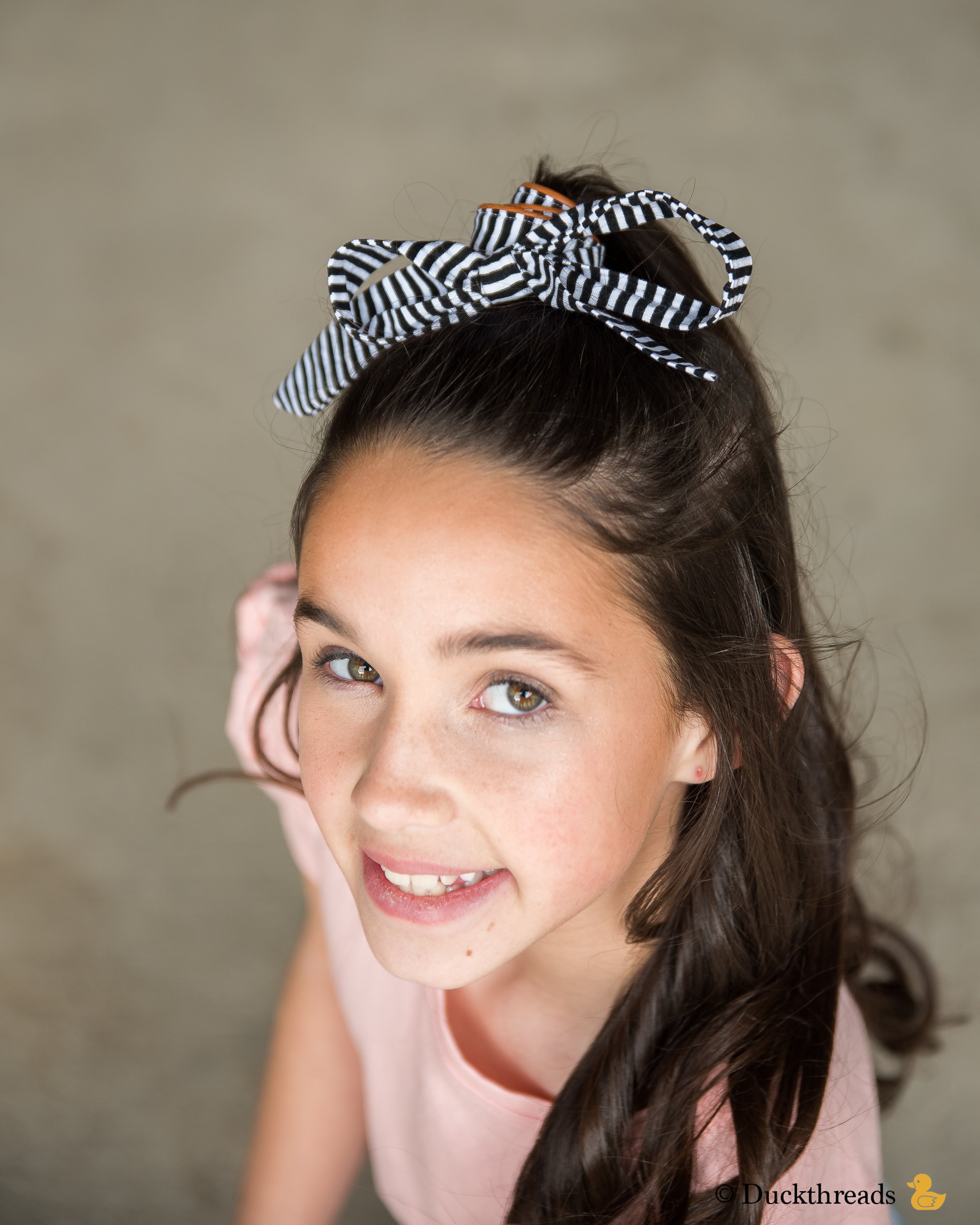 BeltBand reversible belt and headband made from leather and cotton fabric, showcasing black and white stripes.