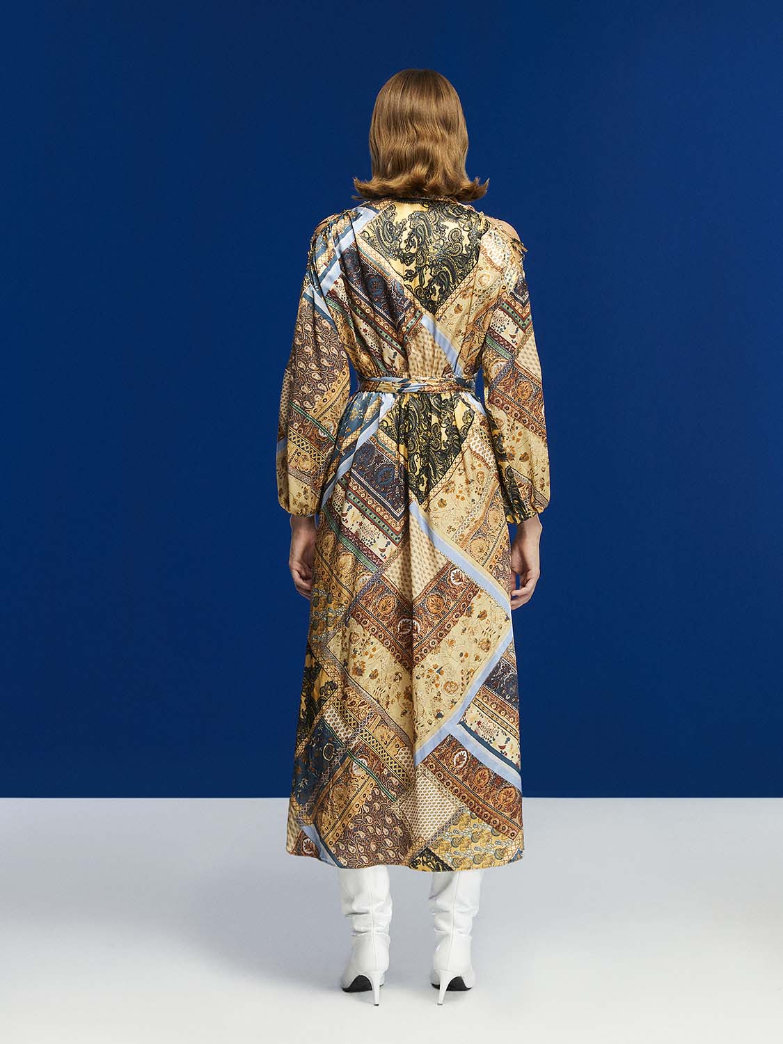 A stylish long-sleeved belted print dress in toasty brown with a Mandarin collar and side slits, perfect for winter wear.