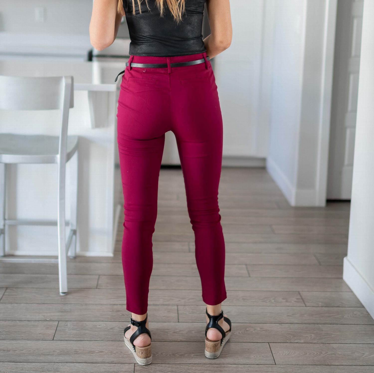 Bengaline Belted Pants in ruby red with a skinny built-in belt and rear pockets, perfect for stylish outfits.