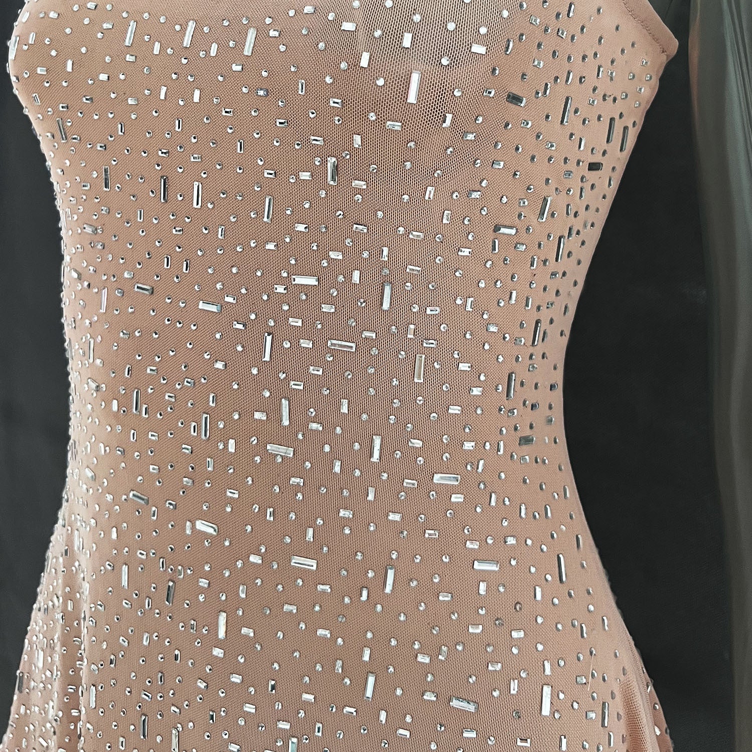 A stunning light diamond sexy sling mermaid dress featuring rhinestone embellishments and a sleeveless spaghetti strap design, perfect for formal occasions.