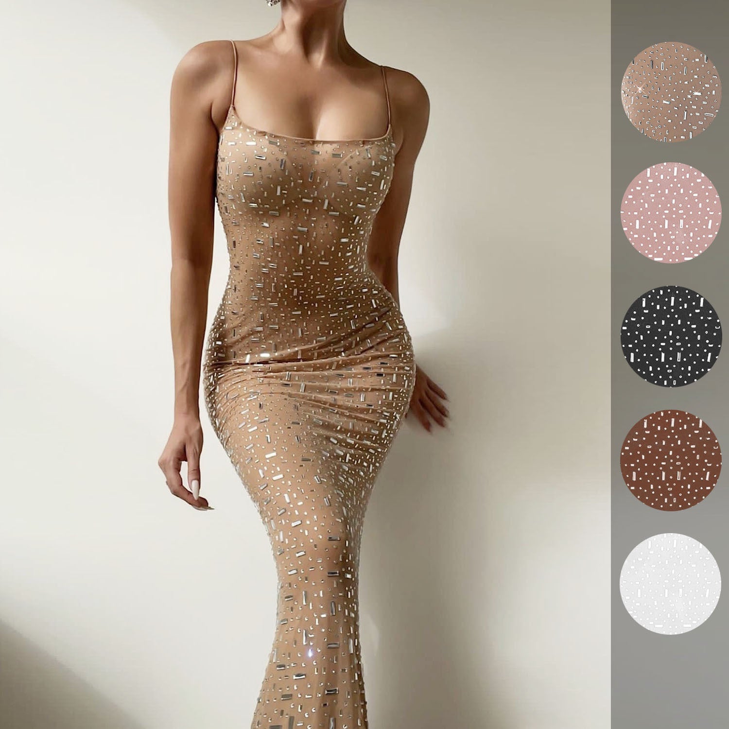 A stunning light diamond sexy sling mermaid dress featuring rhinestone embellishments and a sleeveless spaghetti strap design, perfect for formal occasions.