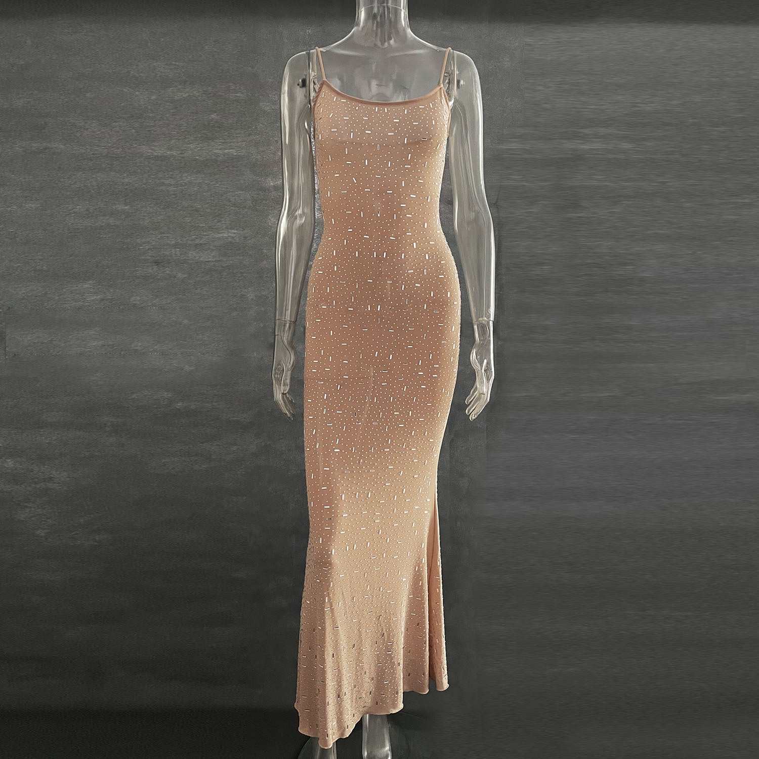 A stunning light diamond sexy sling mermaid dress featuring rhinestone embellishments and a sleeveless spaghetti strap design, perfect for formal occasions.