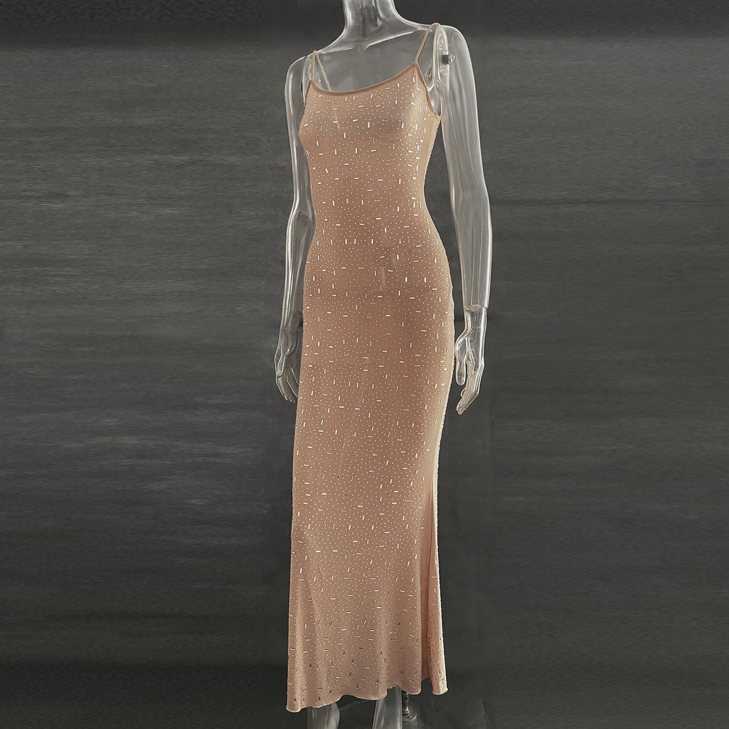 A stunning light diamond sexy sling mermaid dress featuring rhinestone embellishments and a sleeveless spaghetti strap design, perfect for formal occasions.