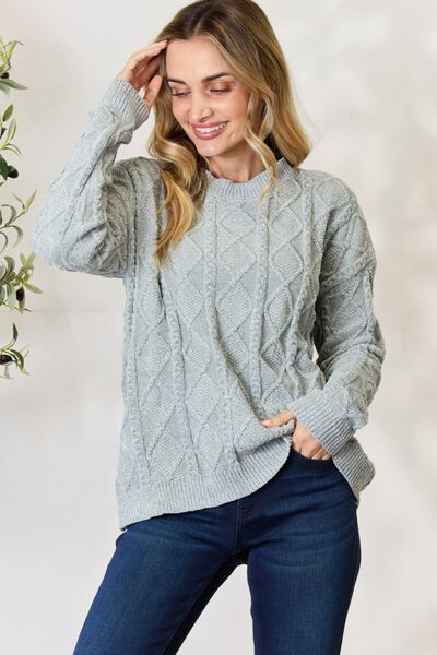 BiBi Cable Knit Round Neck Sweater in a cozy design, showcasing intricate cable knit patterns and a comfortable fit.