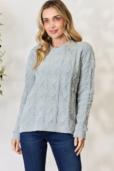 BiBi Cable Knit Round Neck Sweater in a cozy design, showcasing intricate cable knit patterns and a comfortable fit.