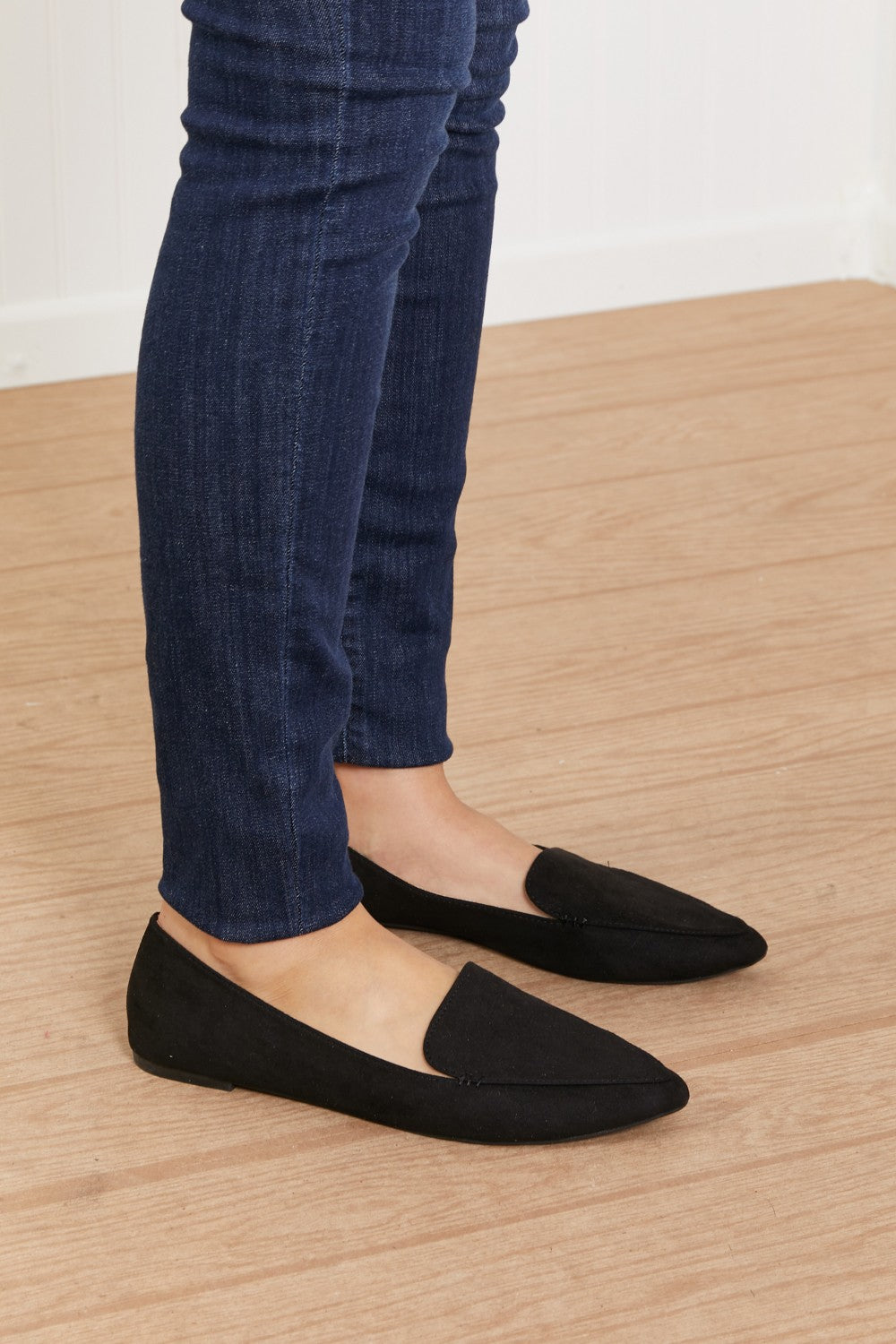 A pair of Big Dreams Ballerina Loafers in vegan suede, featuring a sophisticated point toe design, displayed in a studio flat lay.