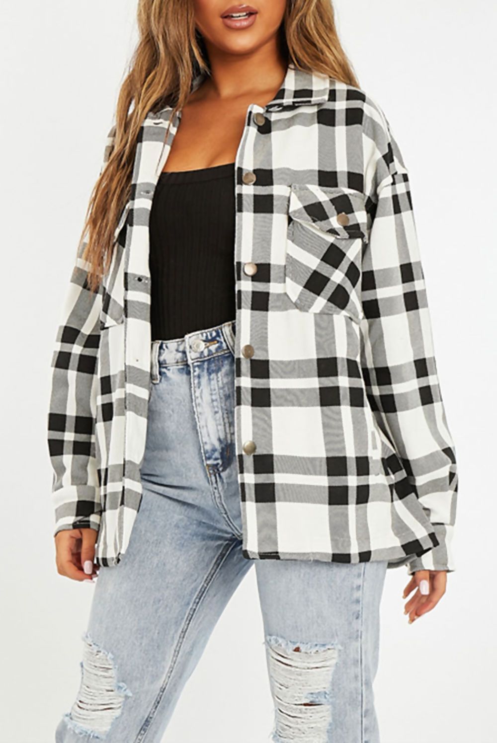 A stylish Black and White Check Shacket for women, featuring an oversized fit, button front, and two chest pockets.