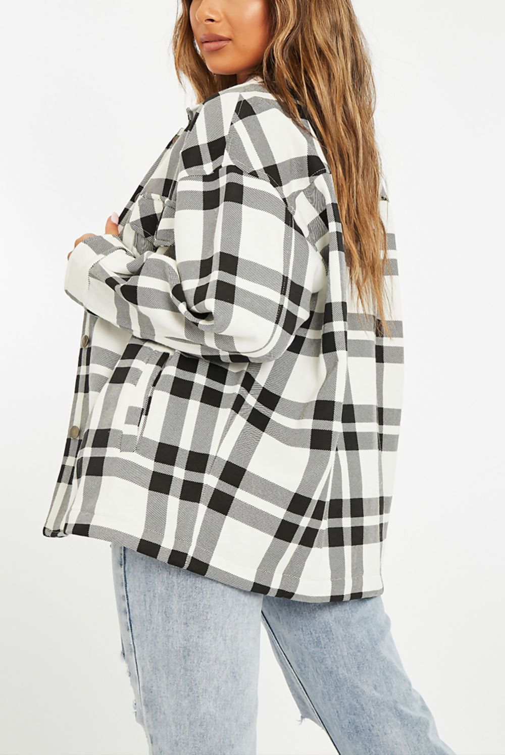 A stylish Black and White Check Shacket for women, featuring an oversized fit, button front, and two chest pockets.