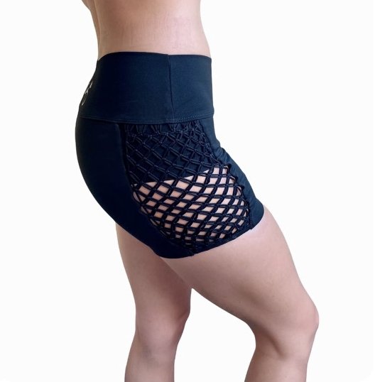 Black & Black Macramé Athletic Shorts featuring mid-rise waistband and stylish macramé side cut-outs, perfect for workouts and casual wear.