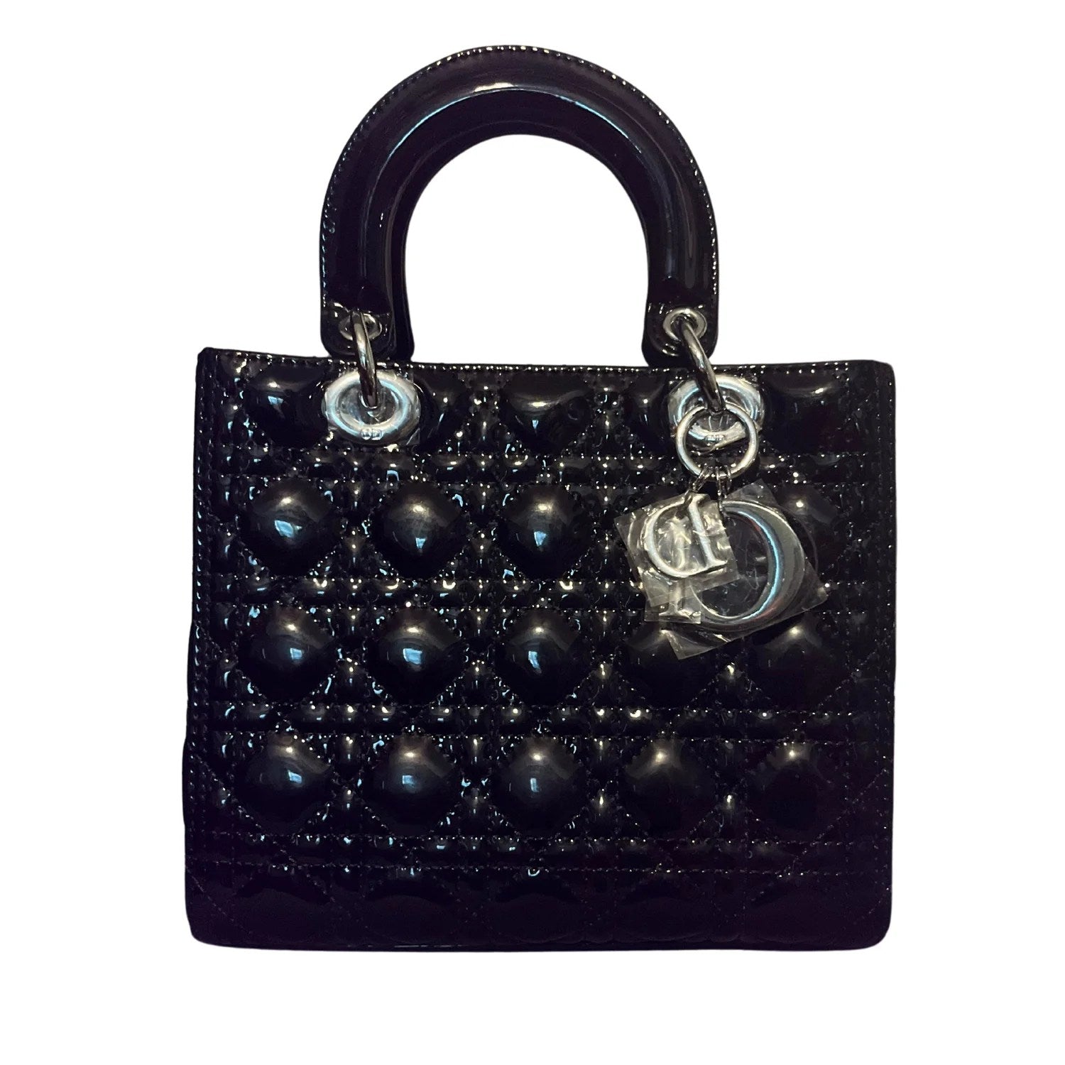 Black Cannage Lambskin Medium Lady Bag showcasing elegant design and luxurious texture.