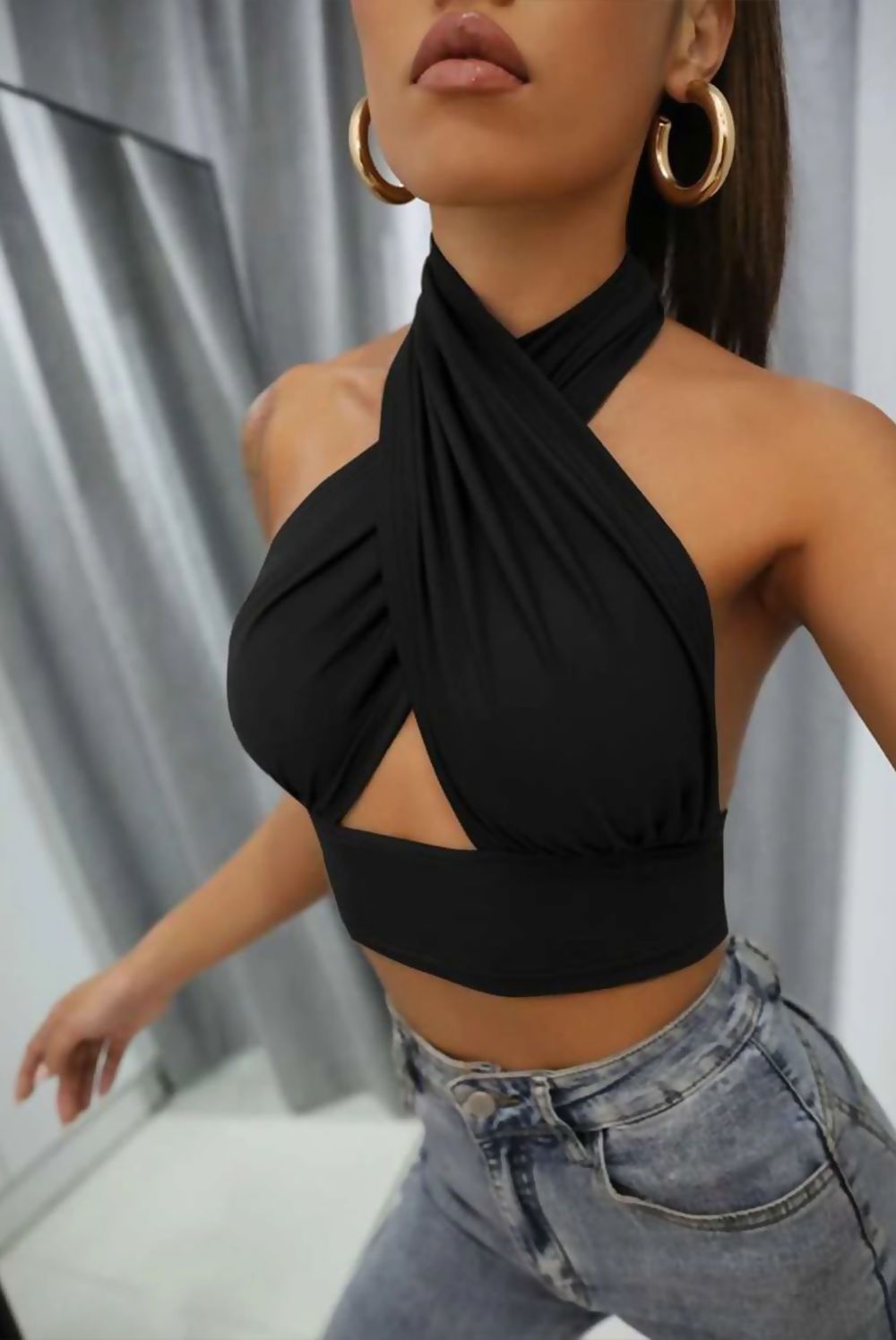 Black Cross Front Halter Neck Underbust Top showcasing a stylish design with underbust detail, perfect for trendy outfits.