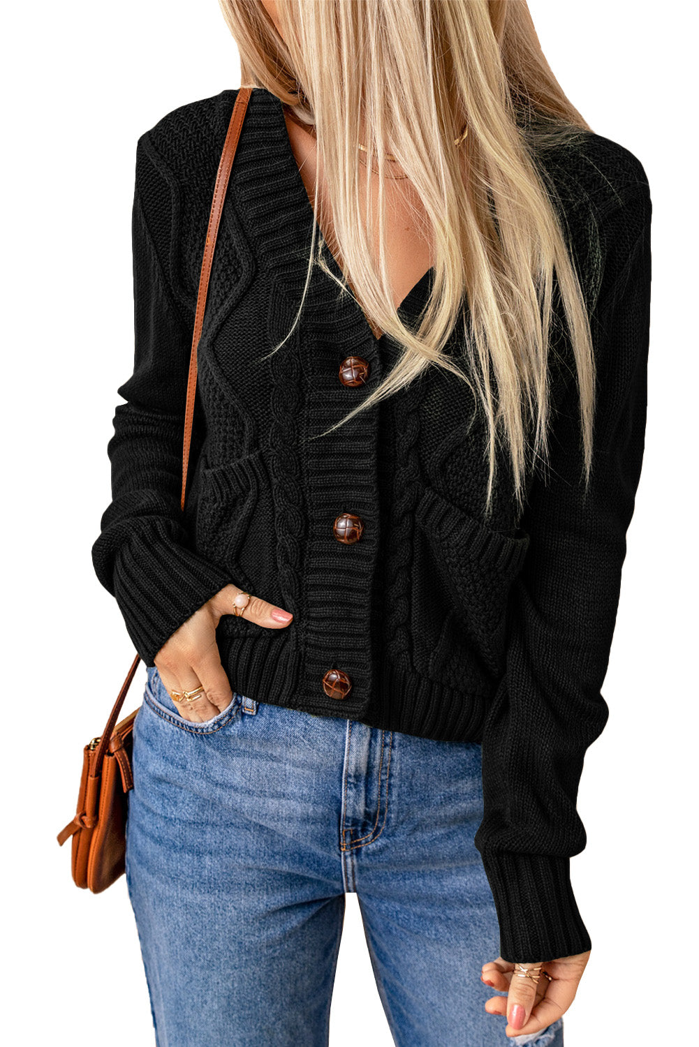 A stylish black cardigan with front pockets and button closure, featuring a textured design, perfect for layering over outfits.