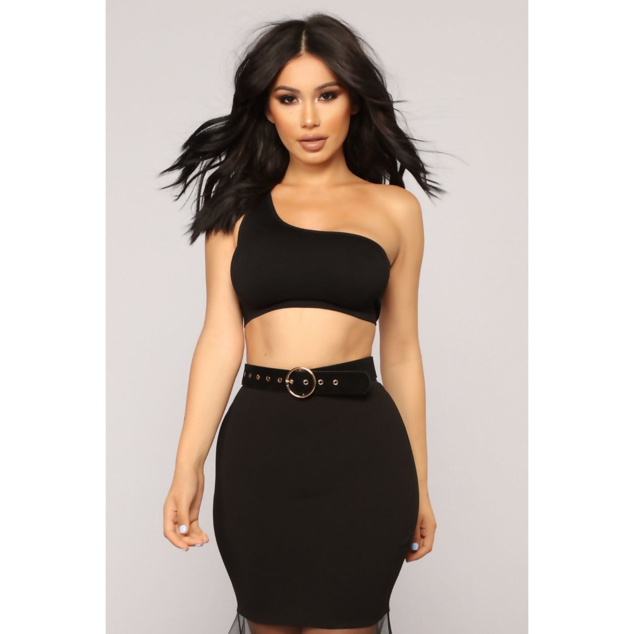 A stylish black one shoulder crop top made from a soft polyester blend, perfect for casual or dressy occasions.