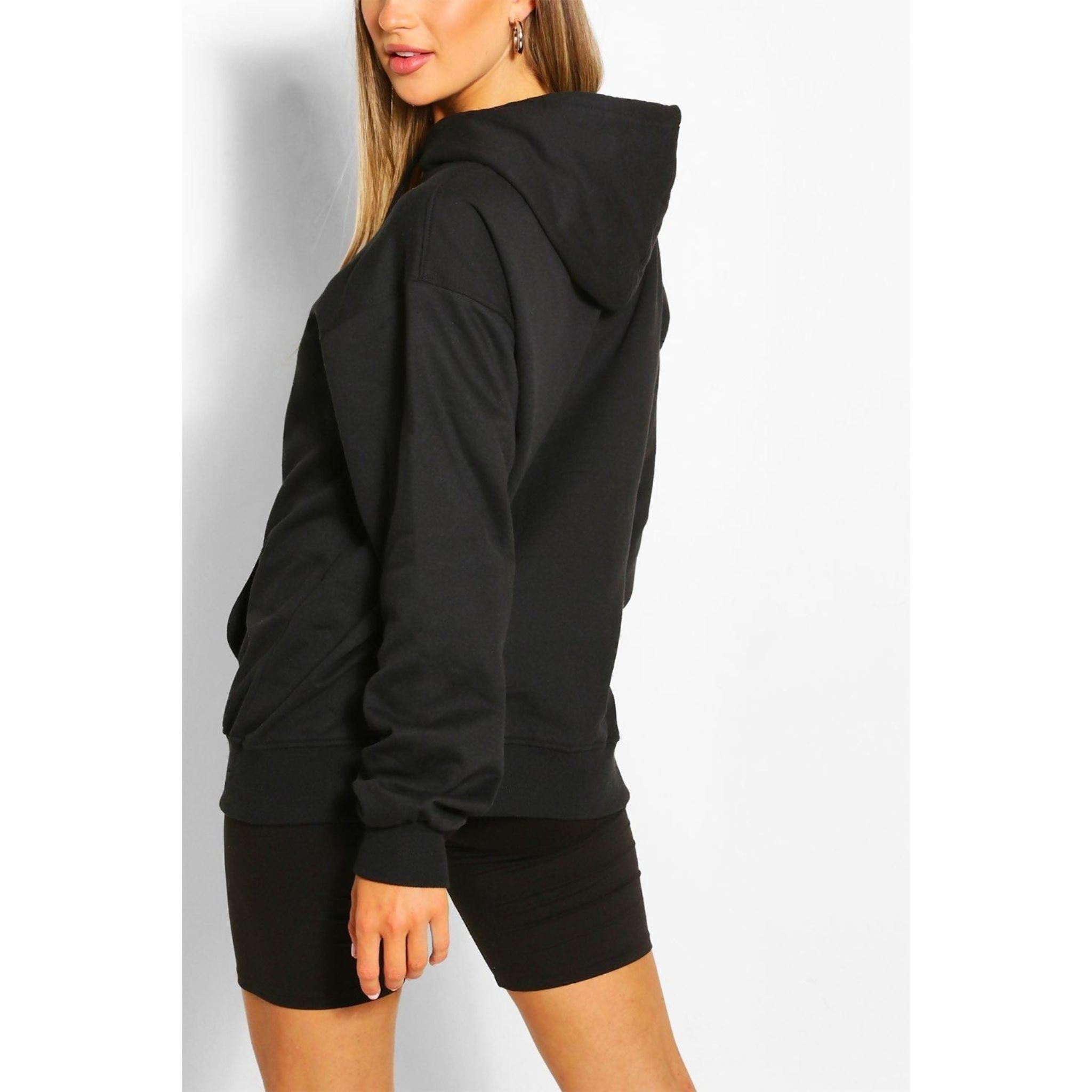 A stylish black oversized boyfriend hoodie displayed on a mannequin, showcasing its relaxed fit and soft fabric.