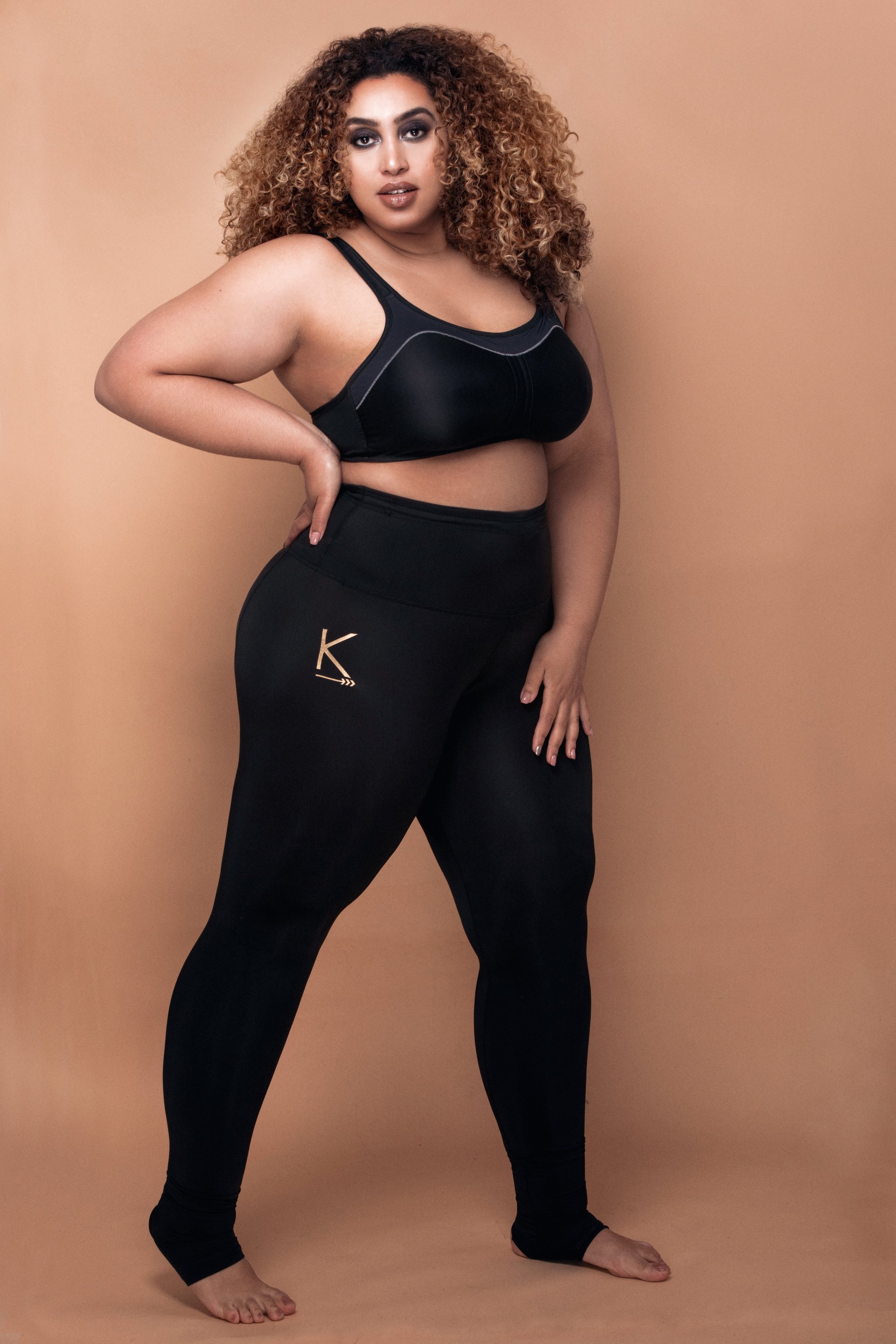 Black Pearl leggings featuring a high waist, sculpting fabric, and drawstring for adjustable fit, designed for comfort and style.