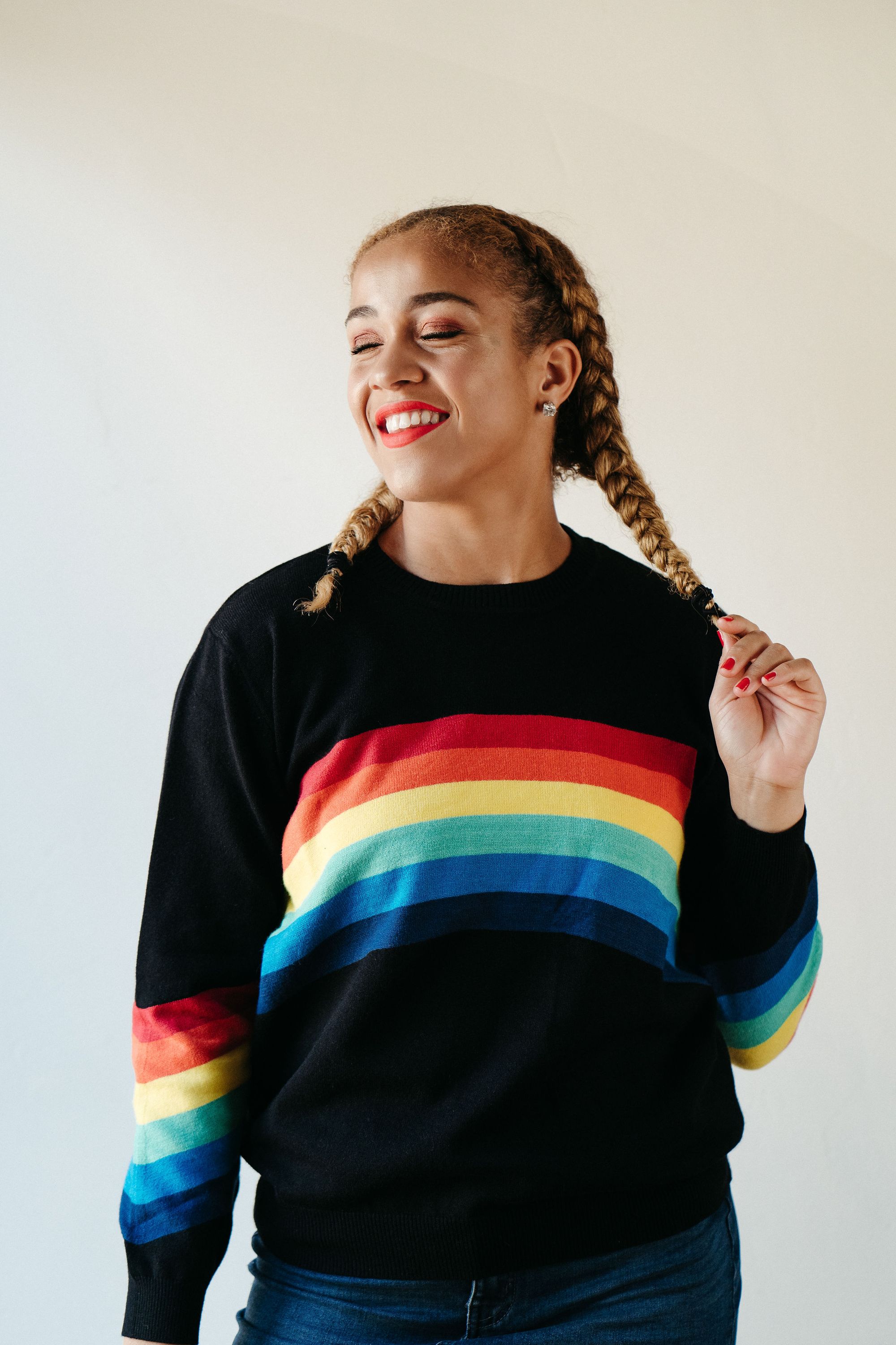 A stylish Black Rainbow Sweater featuring a soft fabric blend, perfect for winter layering and casual outings.