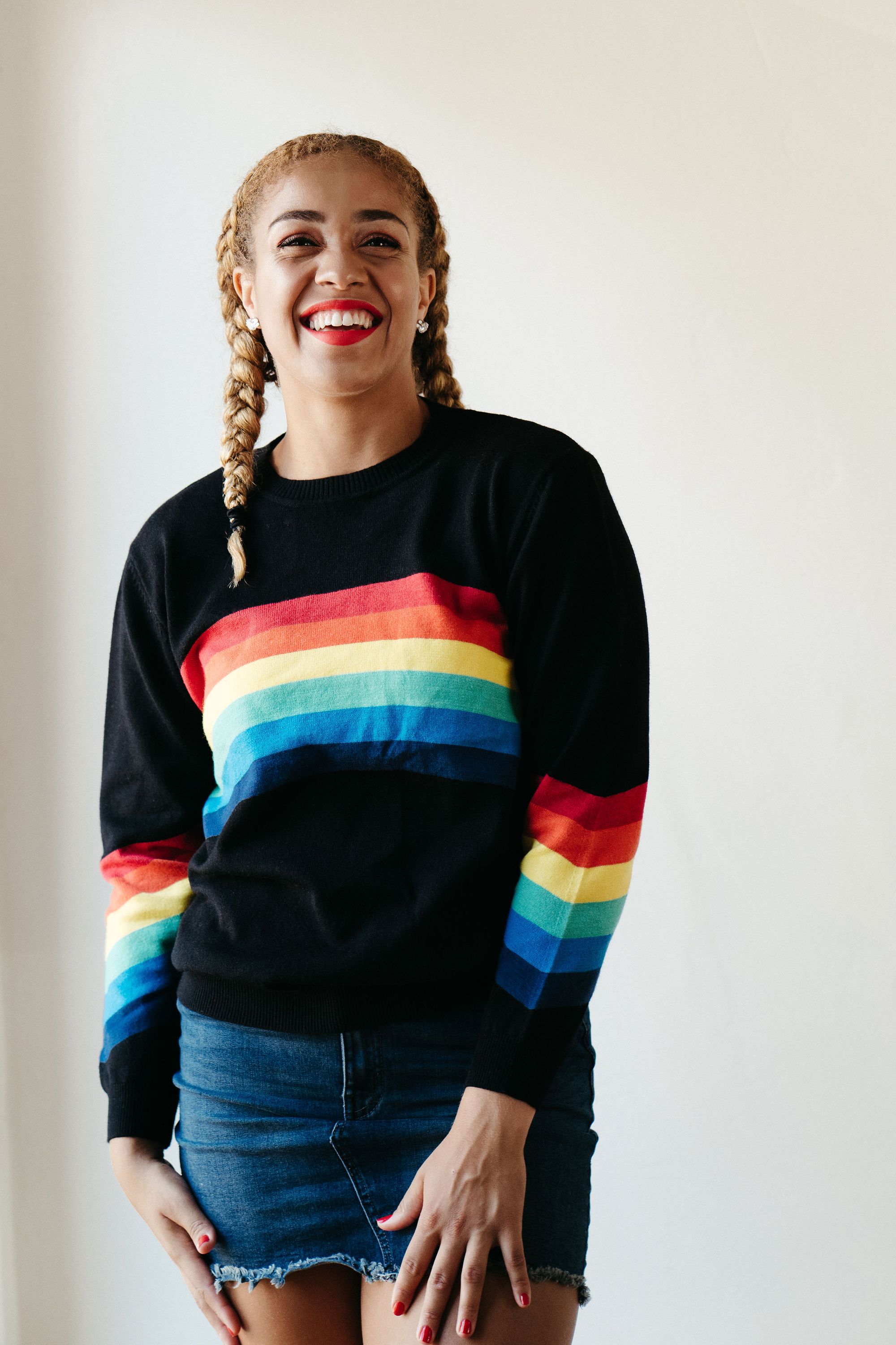 A stylish Black Rainbow Sweater featuring a soft fabric blend, perfect for winter layering and casual outings.