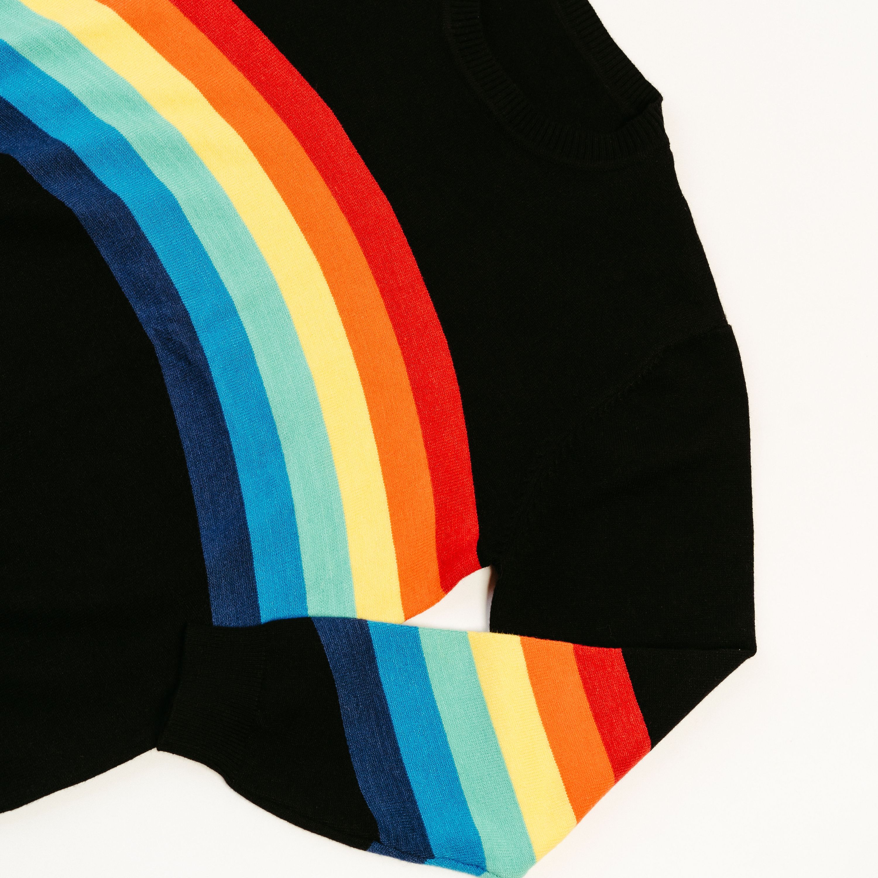 A stylish Black Rainbow Sweater featuring a soft fabric blend, perfect for winter layering and casual outings.