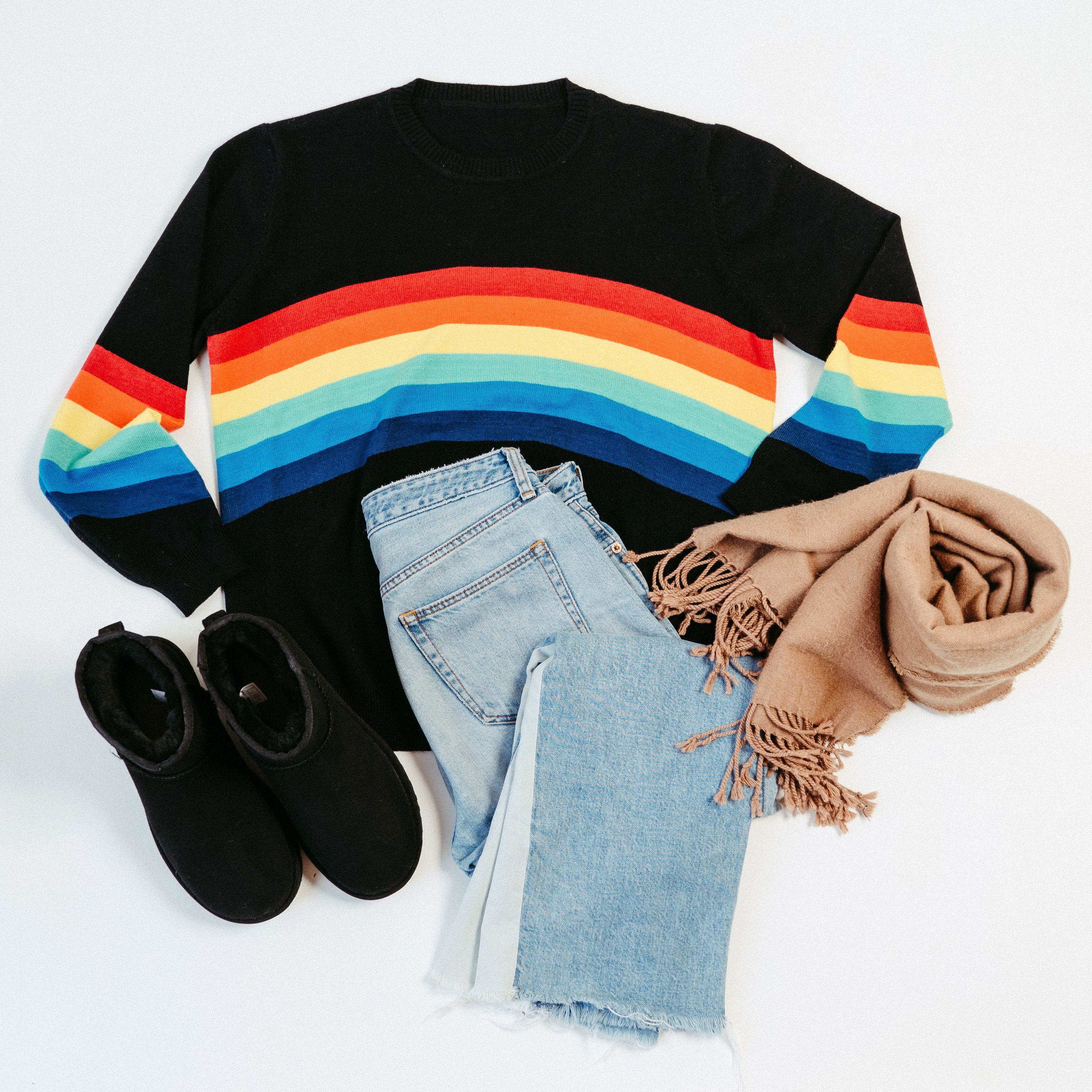 A stylish Black Rainbow Sweater featuring a soft fabric blend, perfect for winter layering and casual outings.