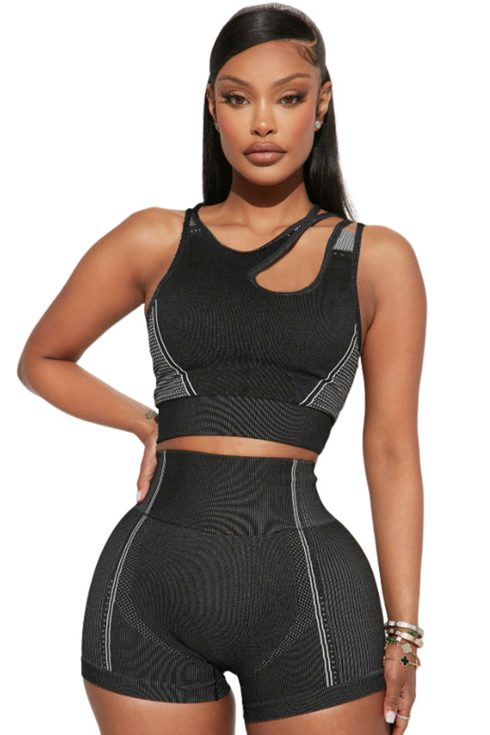 Black strappy mix pattern cutout bra and high-waist shorts set, showcasing stylish design and supportive features for active wear.