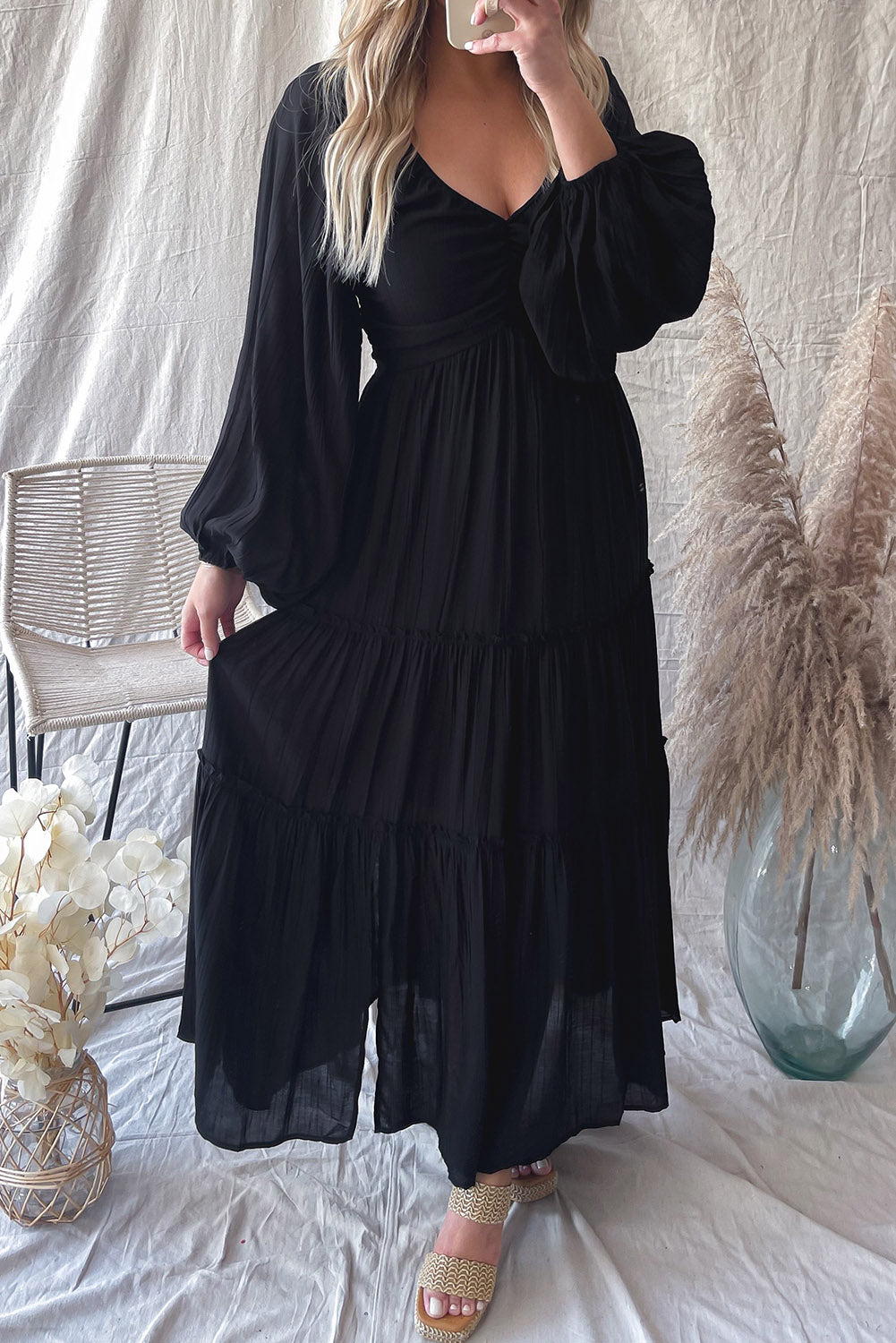 Elegant Black V Neck Bowknot Cutout Frill Tiered Maxi Dress showcasing a flattering neckline and ruffled details.