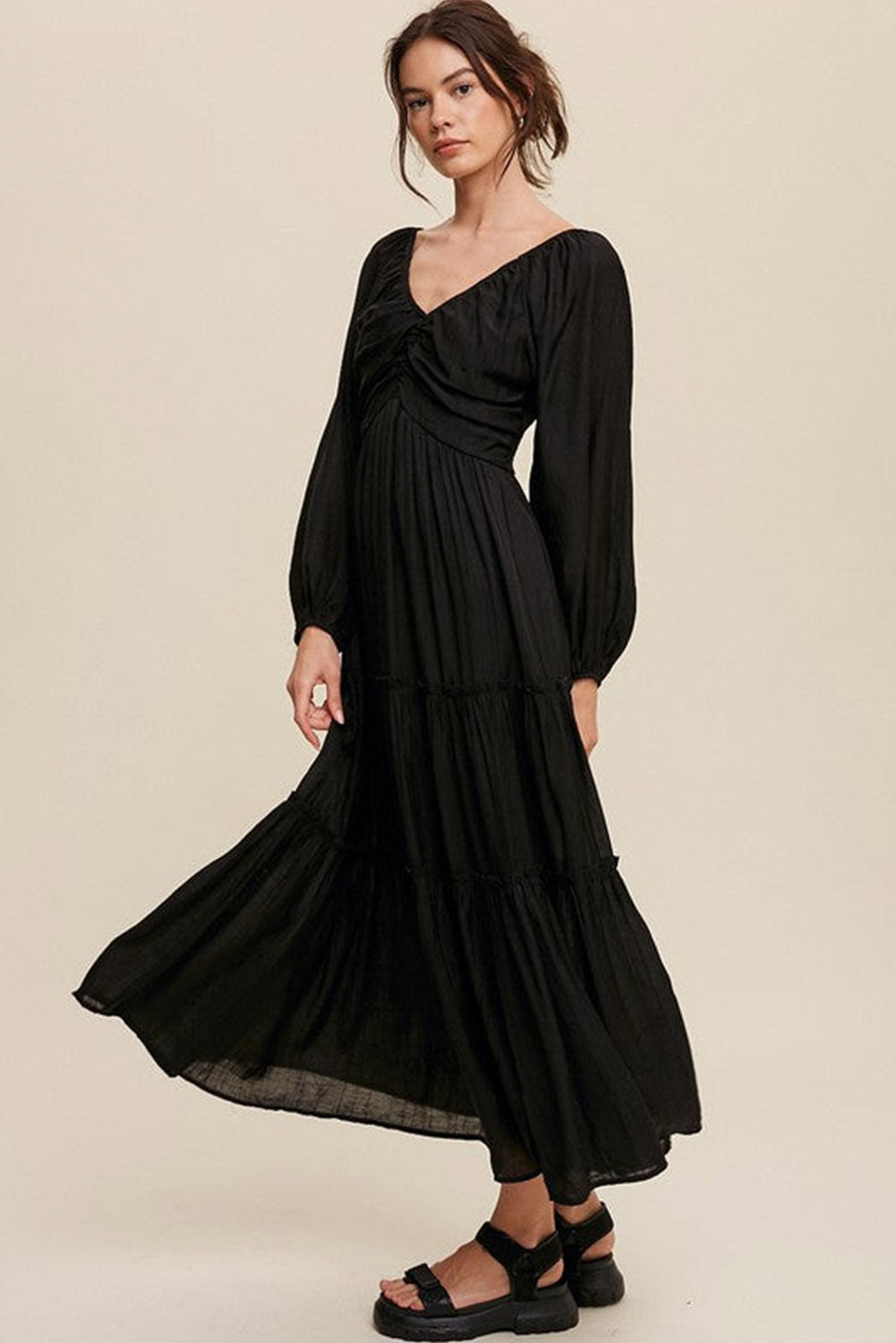 Elegant Black V Neck Bowknot Cutout Frill Tiered Maxi Dress showcasing a flattering neckline and ruffled details.