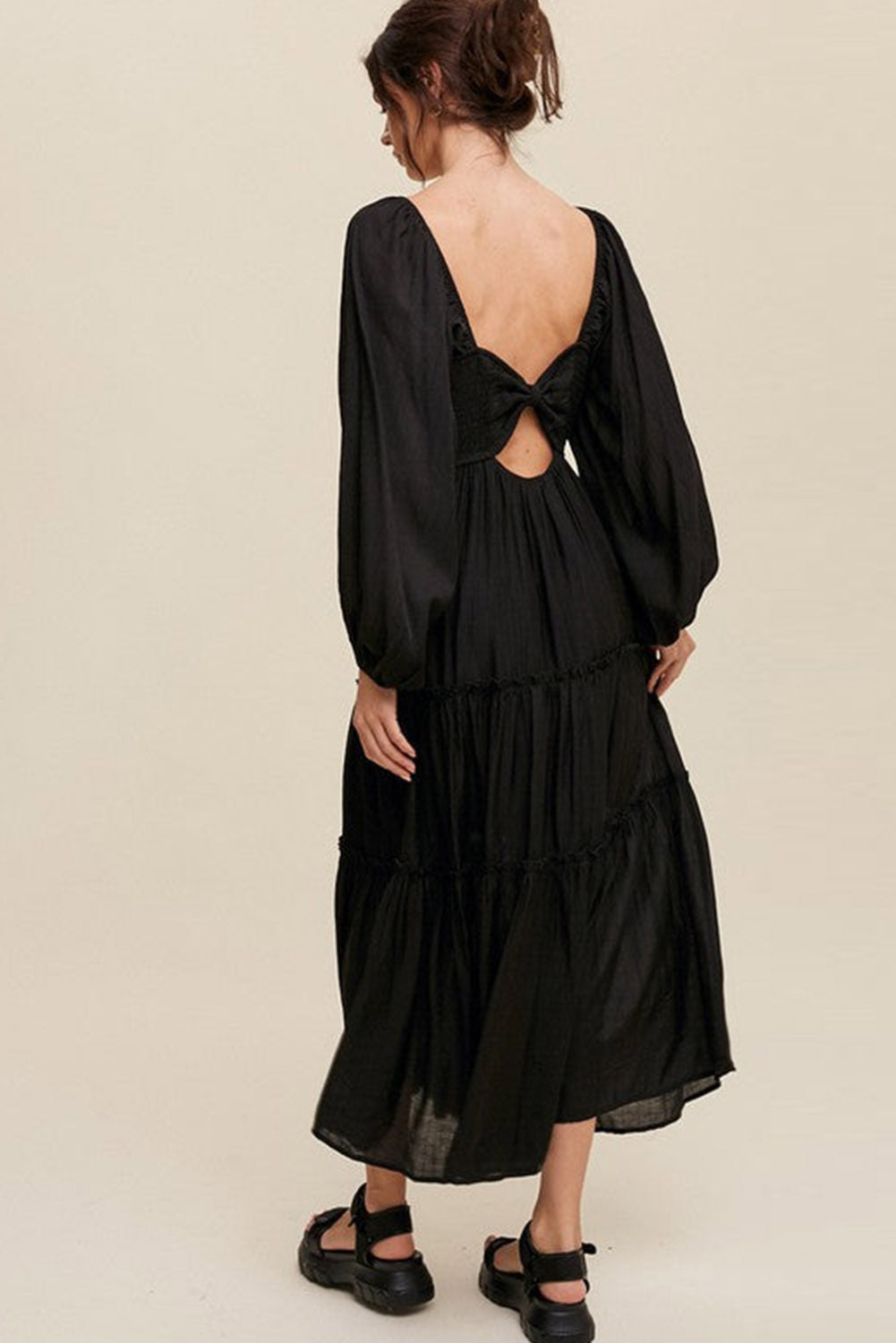 Elegant Black V Neck Bowknot Cutout Frill Tiered Maxi Dress showcasing a flattering neckline and ruffled details.