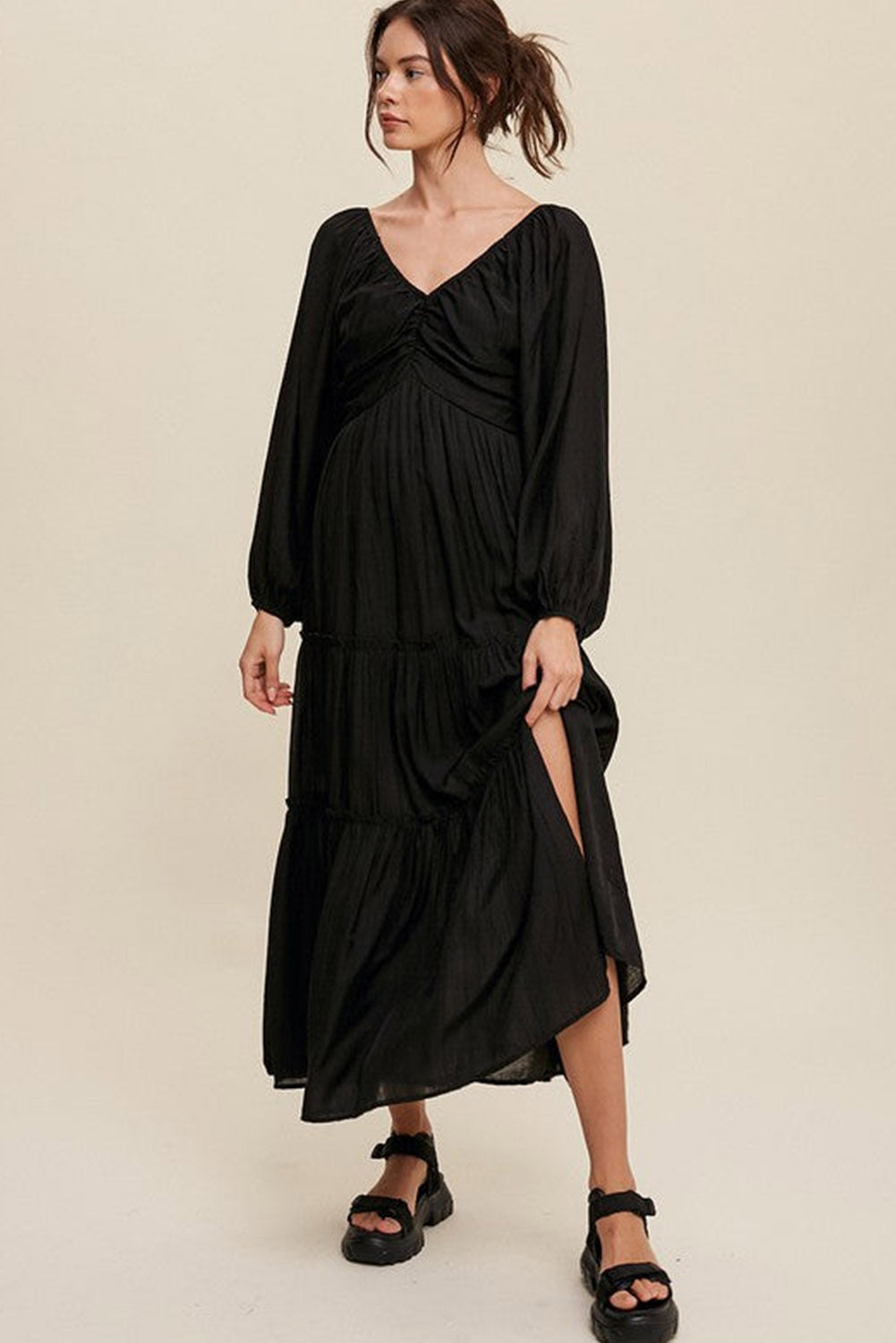 Elegant Black V Neck Bowknot Cutout Frill Tiered Maxi Dress showcasing a flattering neckline and ruffled details.