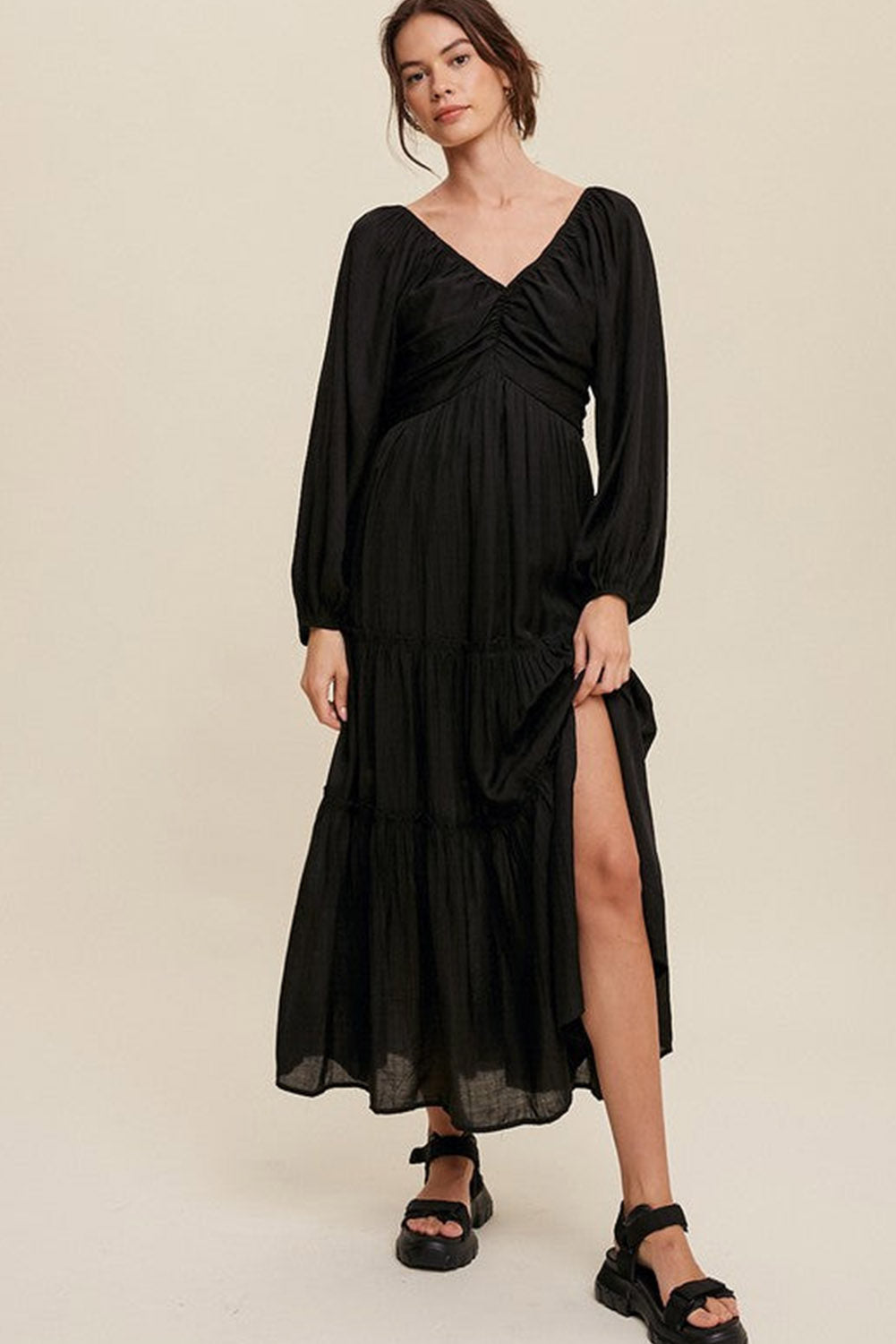 Elegant Black V Neck Bowknot Cutout Frill Tiered Maxi Dress showcasing a flattering neckline and ruffled details.